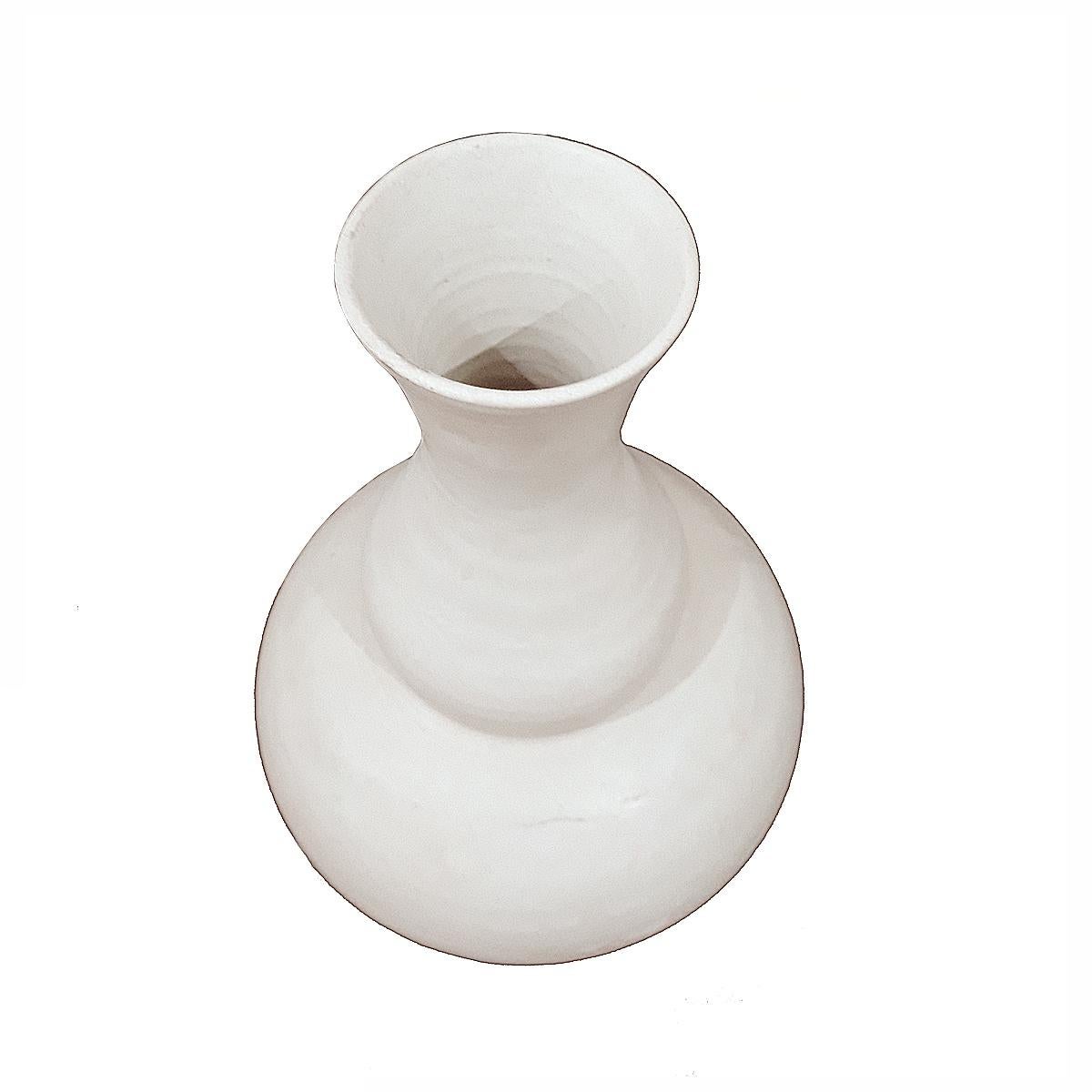 A white ceramic vase from Thailand, circa 1920. Matte white finish, tapered neck.