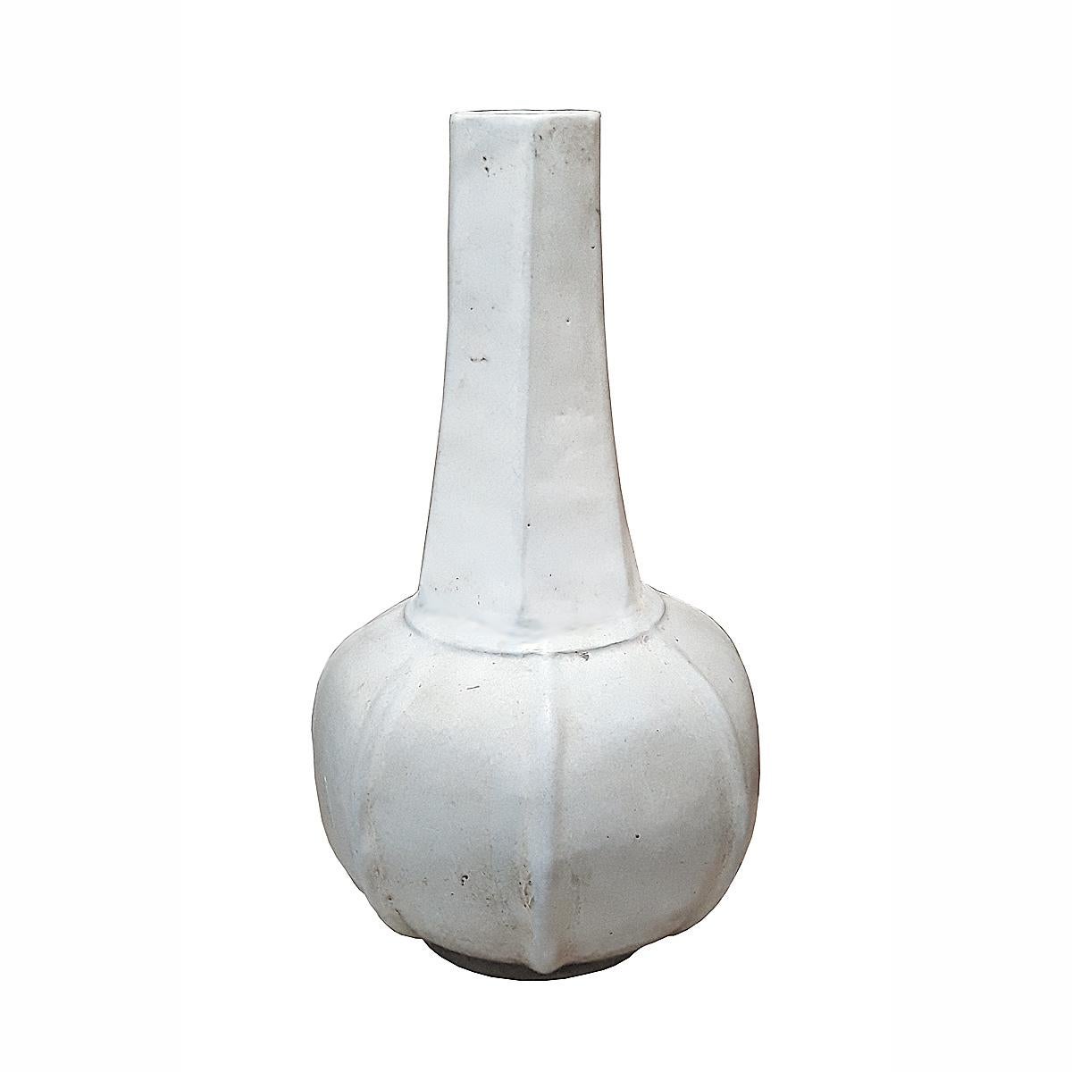 A ceramic vase handcrafted in Sri Satchanalai, Thailand, circa 1965. White smooth glaze, narrow bottle-style opening, geometric design. 16.5 inches high x 9 inches in diameter.