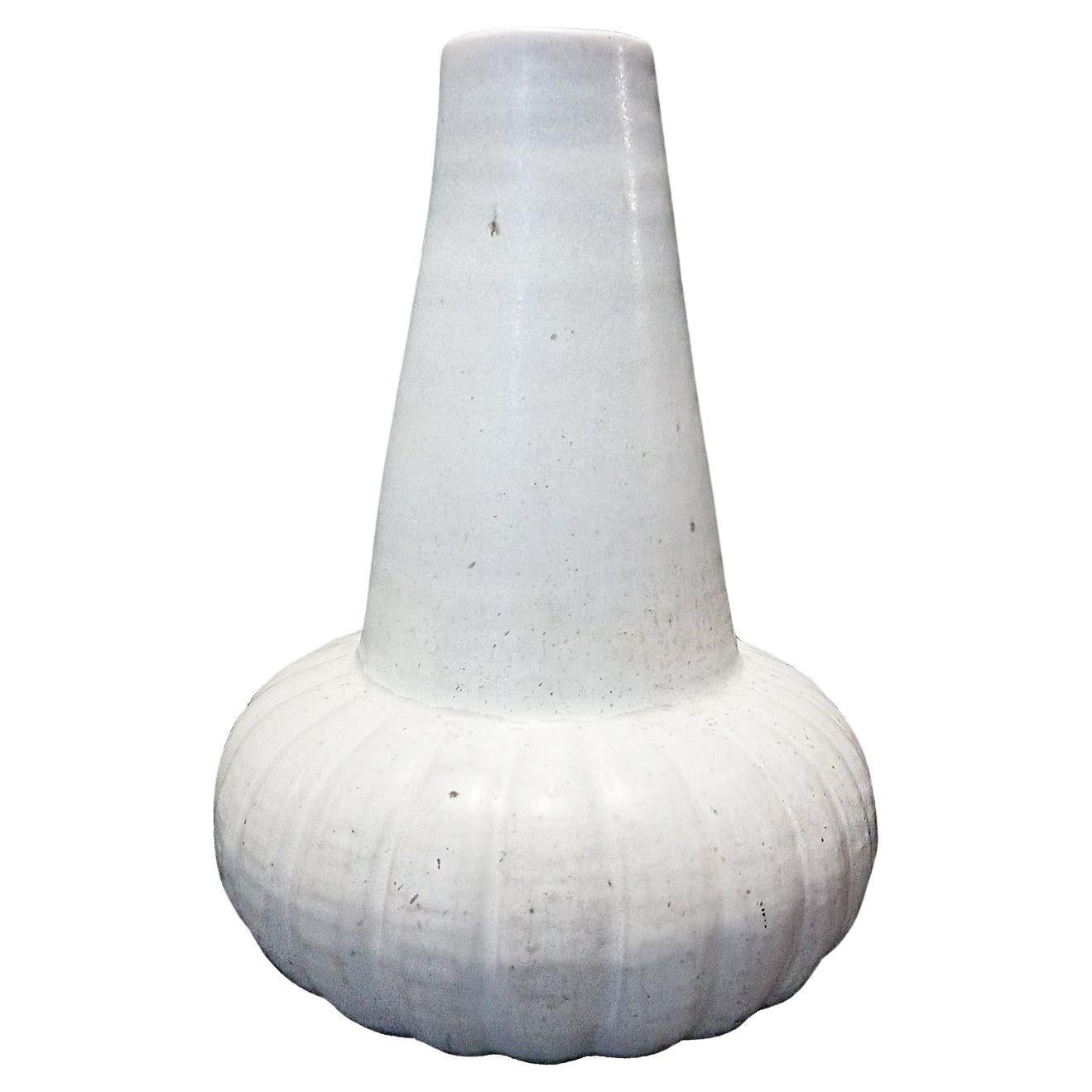 A ceramic vase from Thailand, with off-white glaze. Contemporary. 

While the golden age of Thai ceramics ended around the 15-16th Centuries, local craftsmen perpetuated the art through generations, later producing a smaller number of pieces with