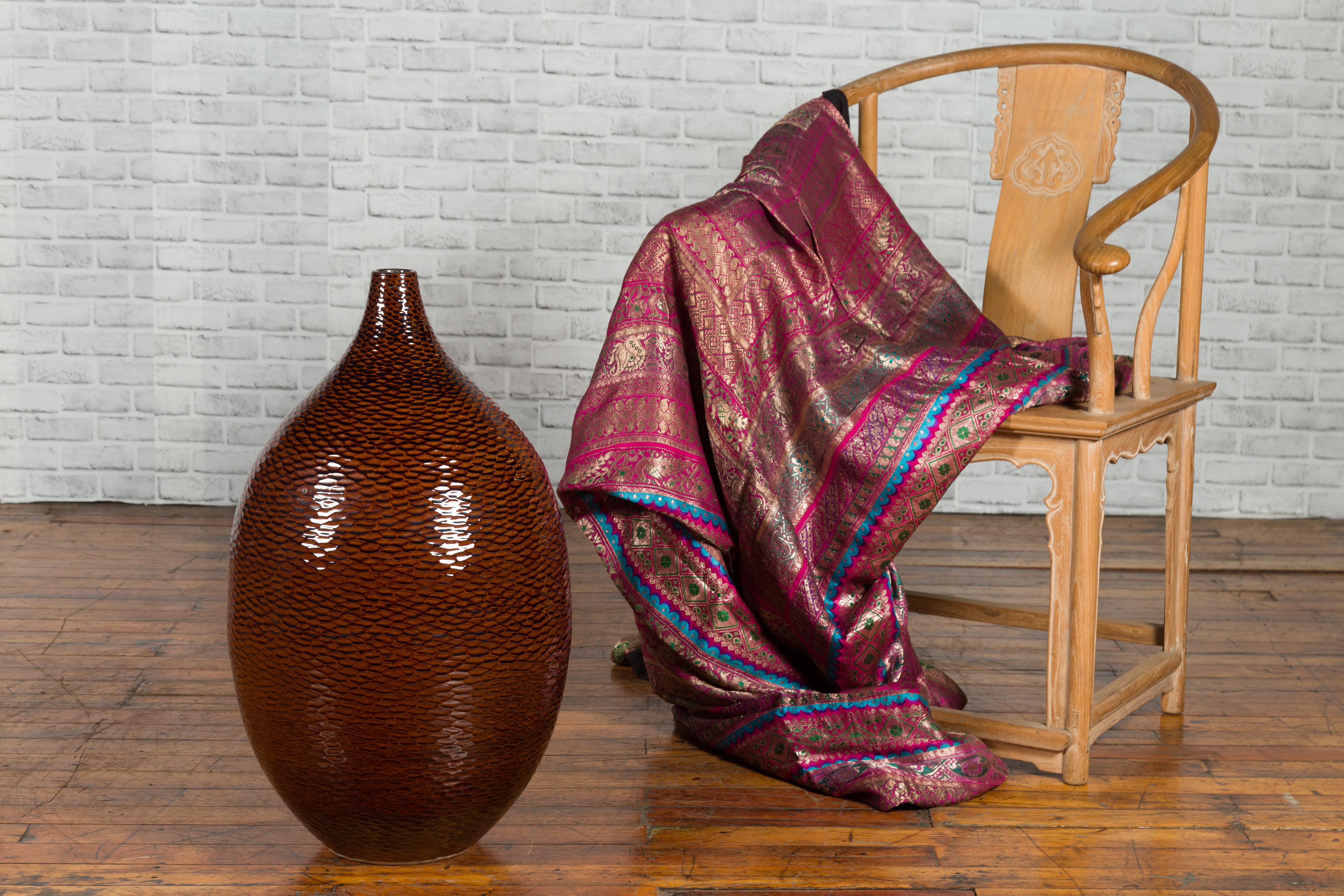 A Thai Chiang Mai brown textured vase from the Prem collection, with teardrop shape. We currently have two available, priced and sold $1,200 each. Created in Chiang Mai, Northern Thailand during the 20th century, this Prem collection vase features a