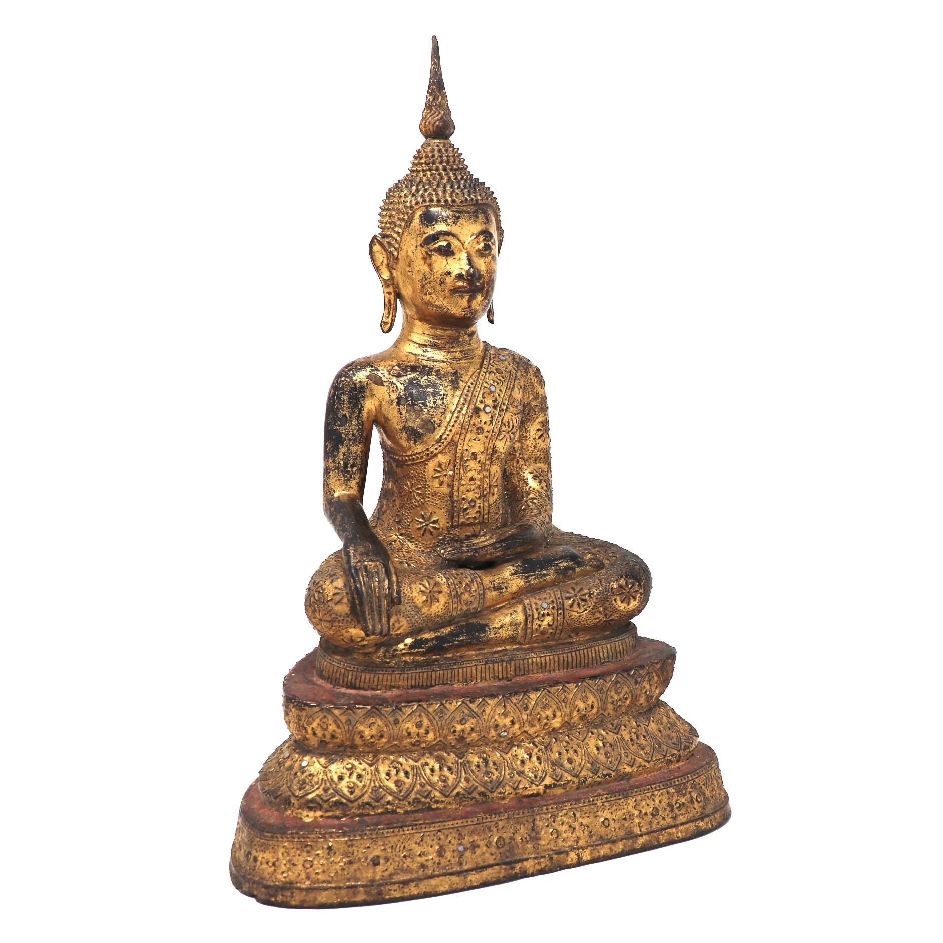 Thai Gilt Bronze Figure of a Seated Buddha, depicted with legs crossed in the virasana position with the right leg resting on the left leg, soles up, the hands in the earth touching position (bhumisparsa mudra), right hand  on the right knee and the