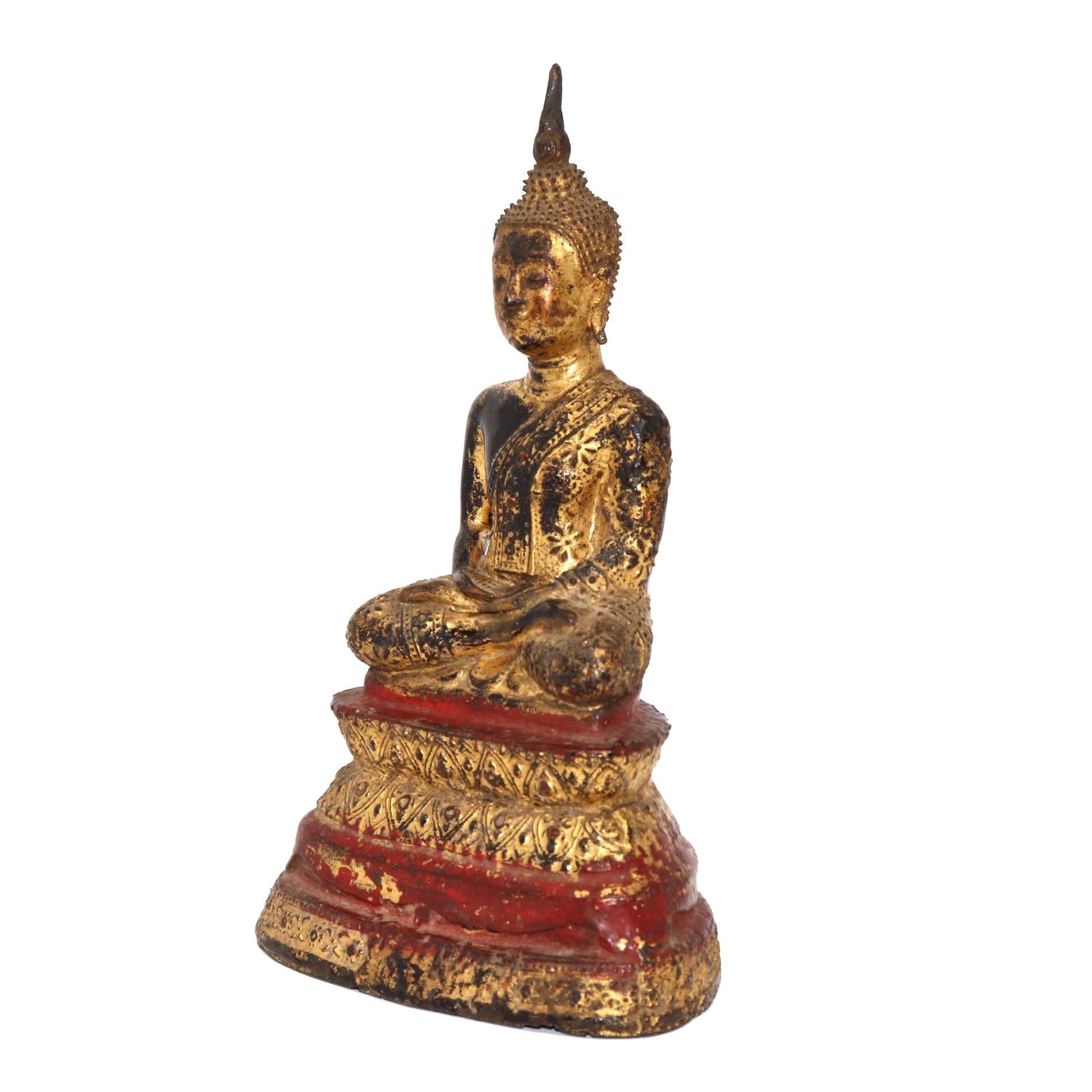 Thai gilt bronze figure of a seated Buddha, depicted with legs crossed in the vajrasana position with the feet resting on the thighs soles up, believed to be the position the Buddha was in when he achieved enlightenment hands overlapping palms up