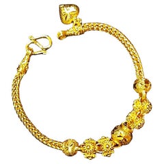 Pulsera de oro pikun flor tailandesa. Latón + plata sobre chapado en oro de 24 quilates.