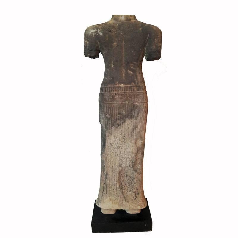 A hand-carved sandstone statue, female, from Thailand, late 20th century. Mounted on a wood stand. Measure: 27