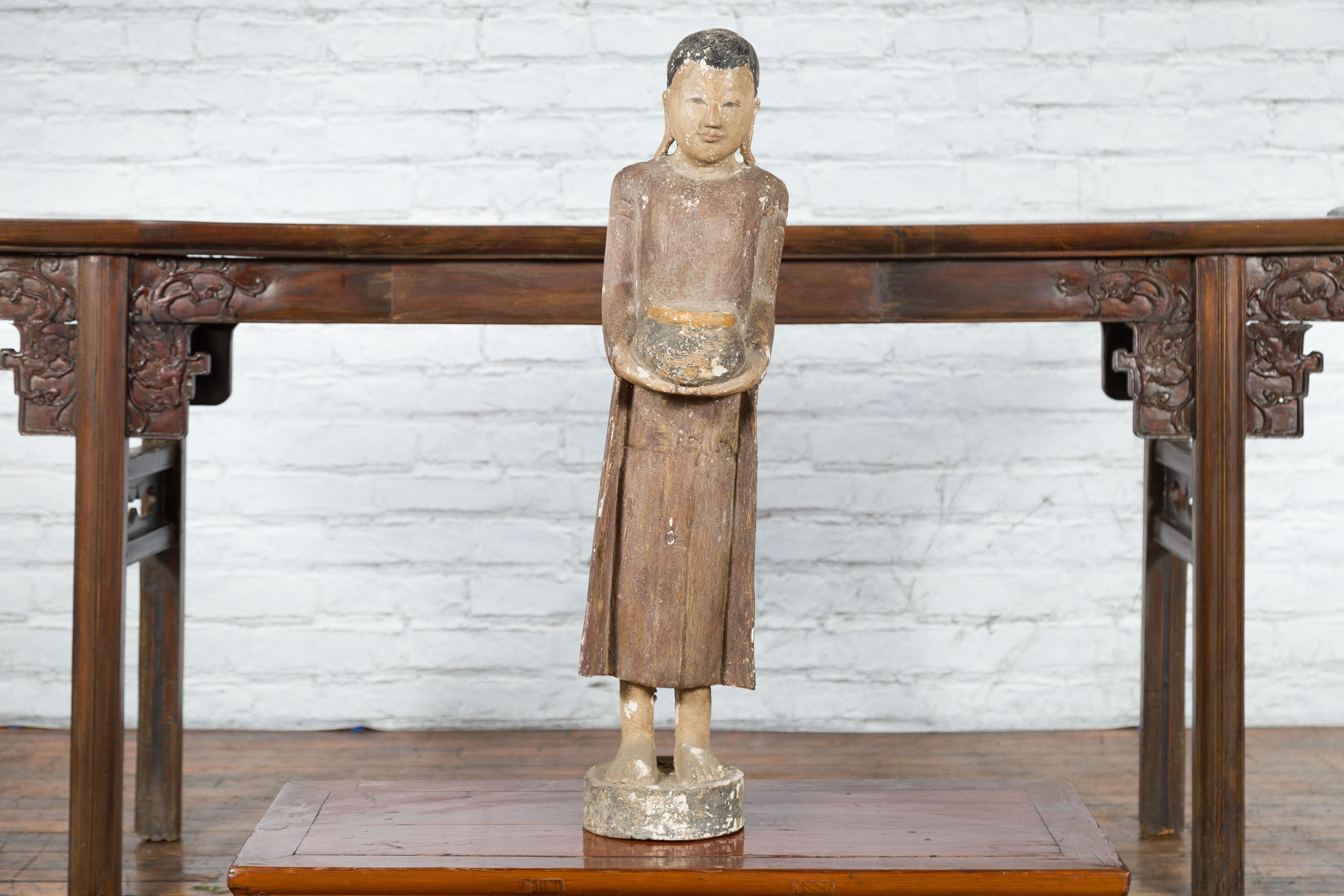 Painted Thai Hand-Carved Standing Buddhist Monk Sculpture on Base with Offering Bowl
