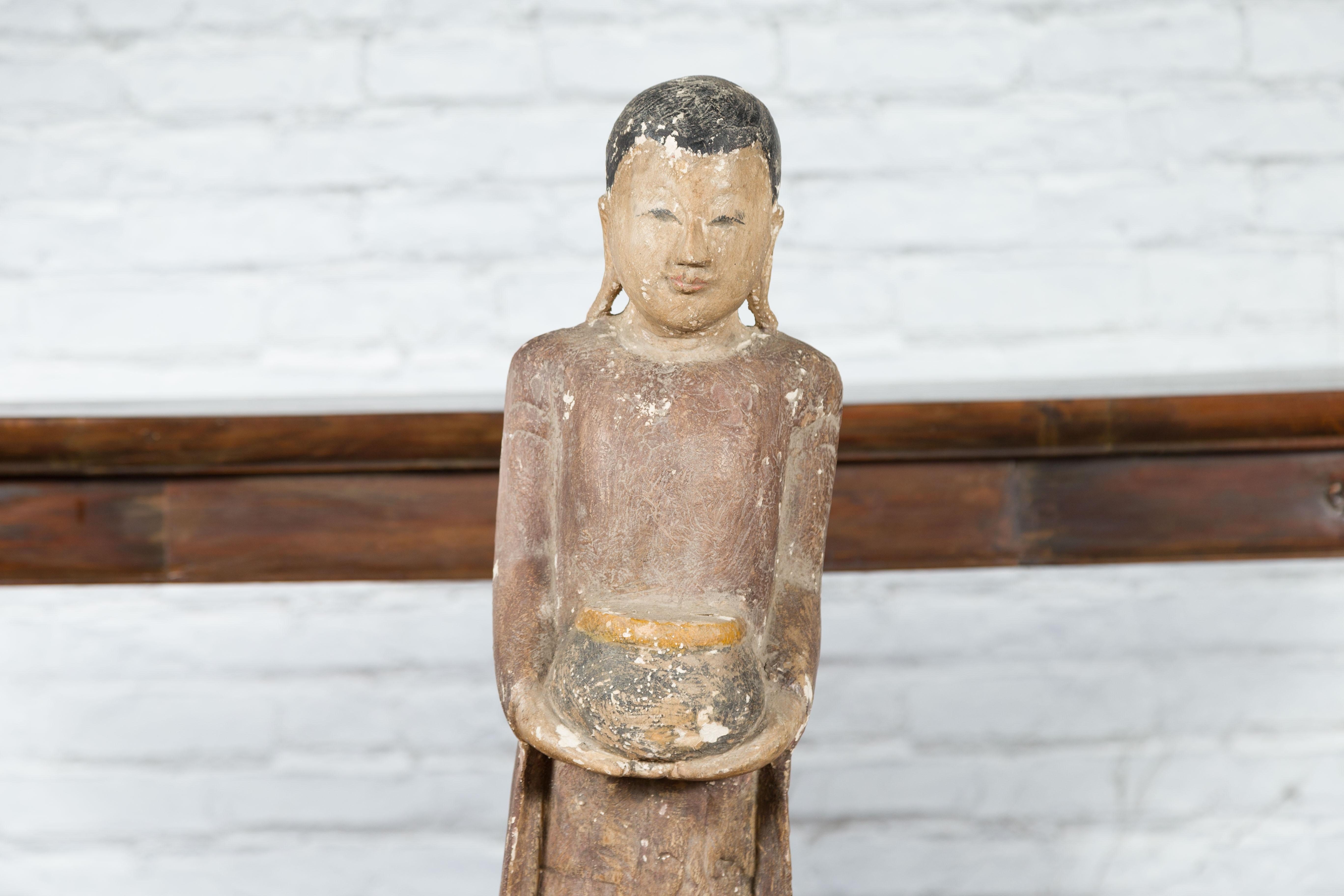 Thai Hand-Carved Standing Buddhist Monk Sculpture on Base with Offering Bowl In Good Condition In Yonkers, NY