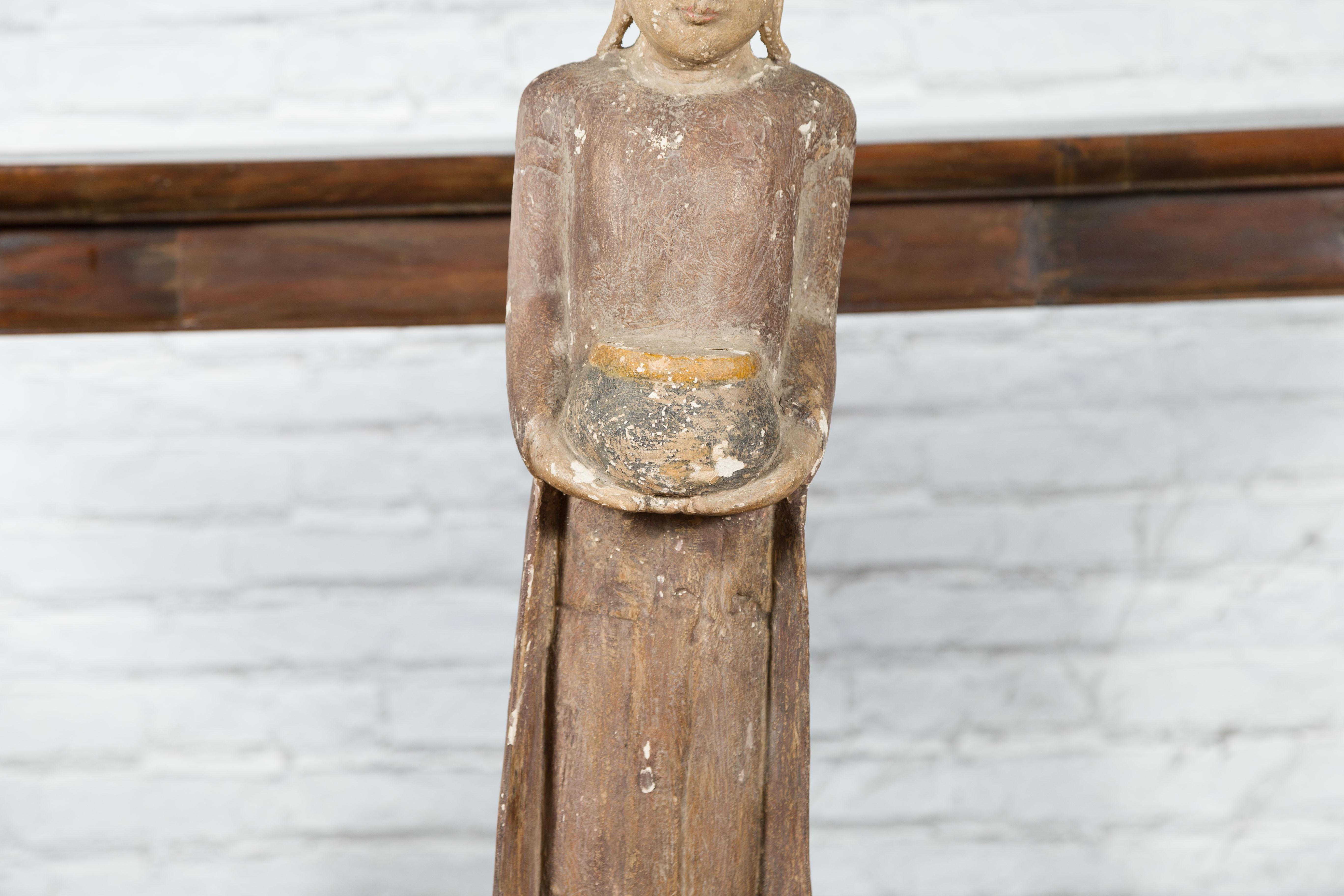 20th Century Thai Hand-Carved Standing Buddhist Monk Sculpture on Base with Offering Bowl