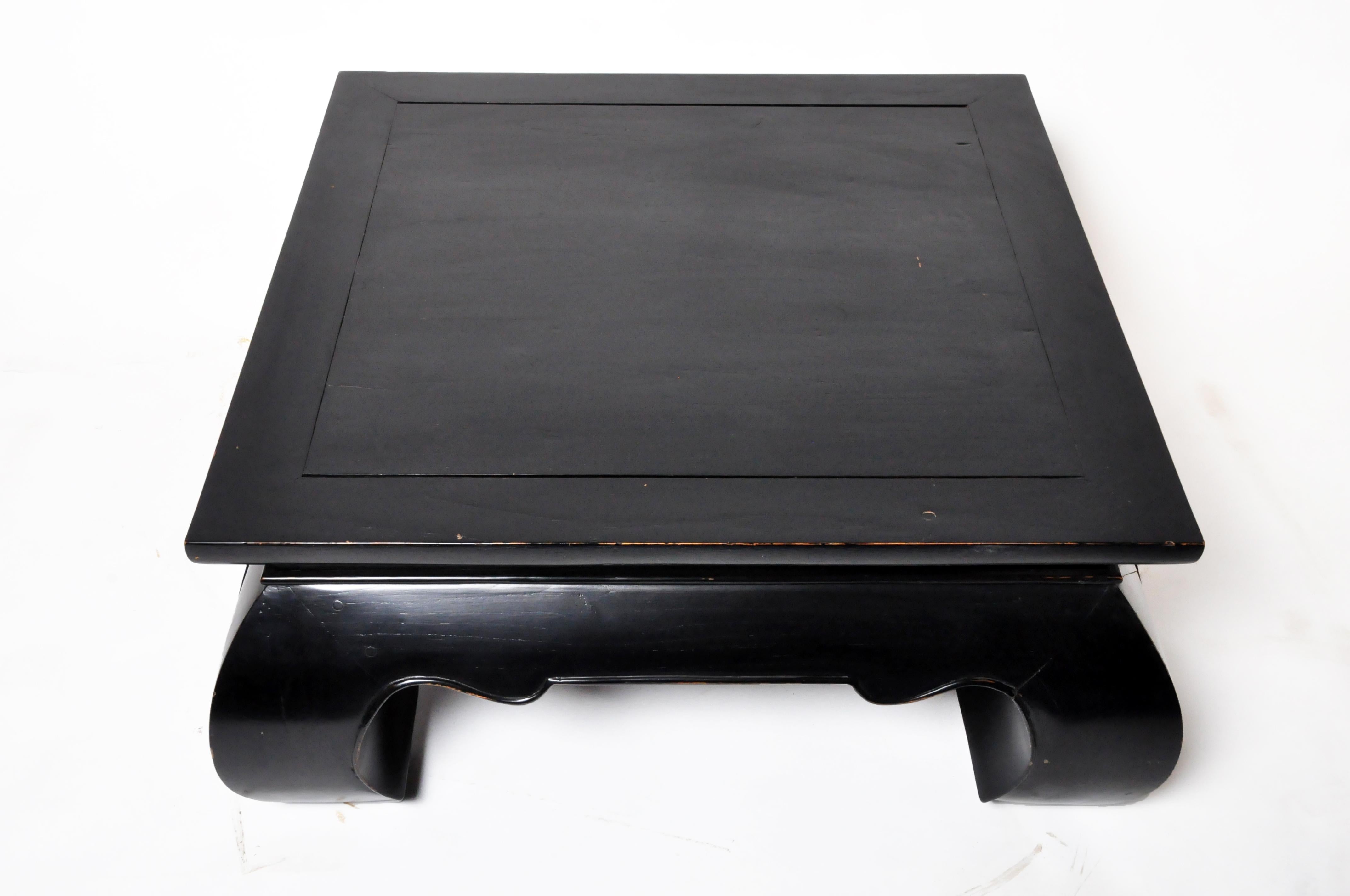 A contemporary Thai Lan Na coffee table with massive curved legs in the Chinese style.  