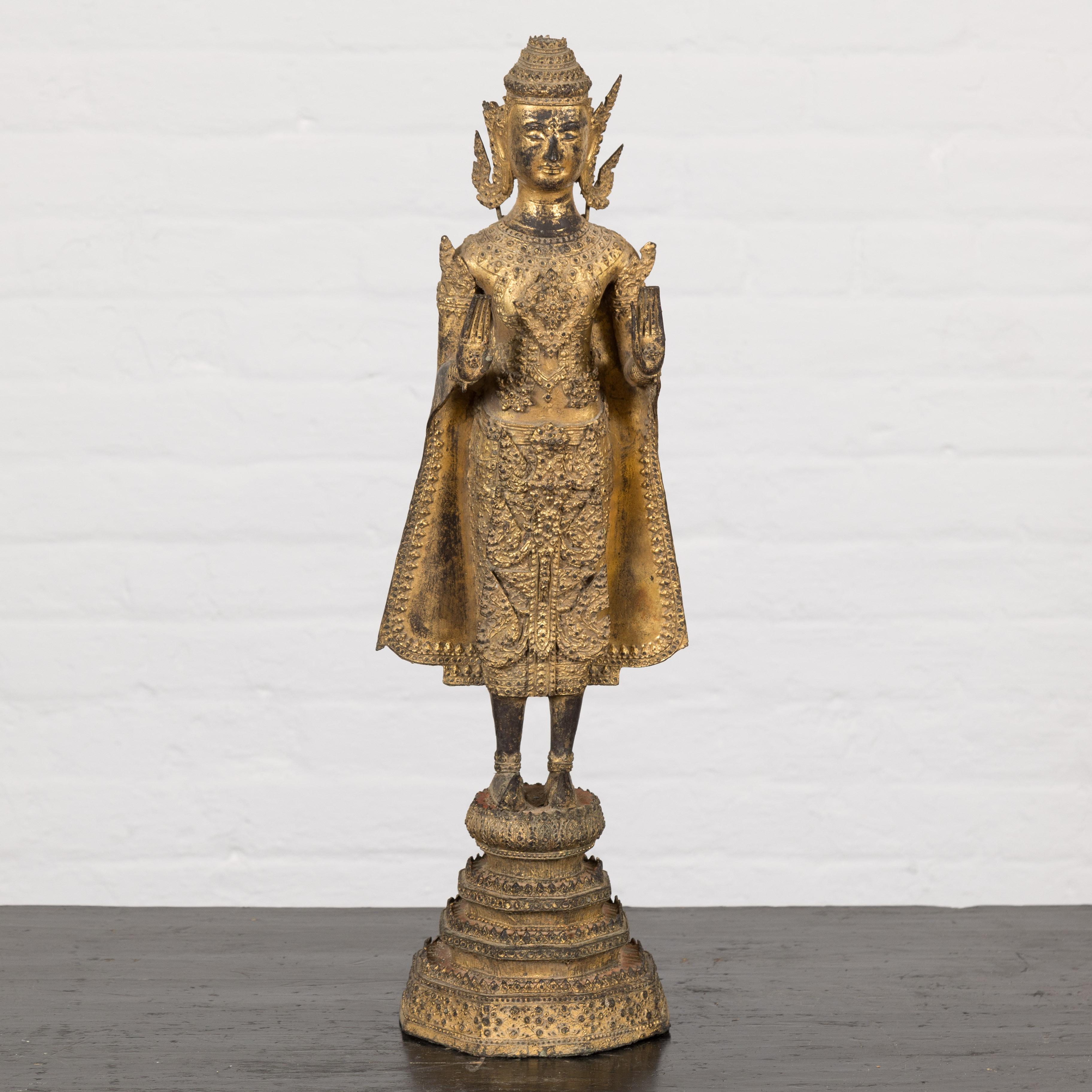A 19th century Thai temple statue made from gilded bronze during the Rattanakosin Period (1782–1932). Steeped in spiritual resonance and artistry, this exquisite 19th-century Thai temple statue gracefully ushers the majesty of the Rattanakosin