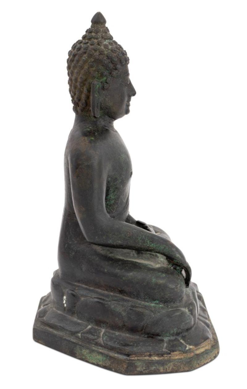 Thai Seated Buddha Patinated Bronze Sculpture, 19th century, the figure atop a lotus pedestal. 8.5