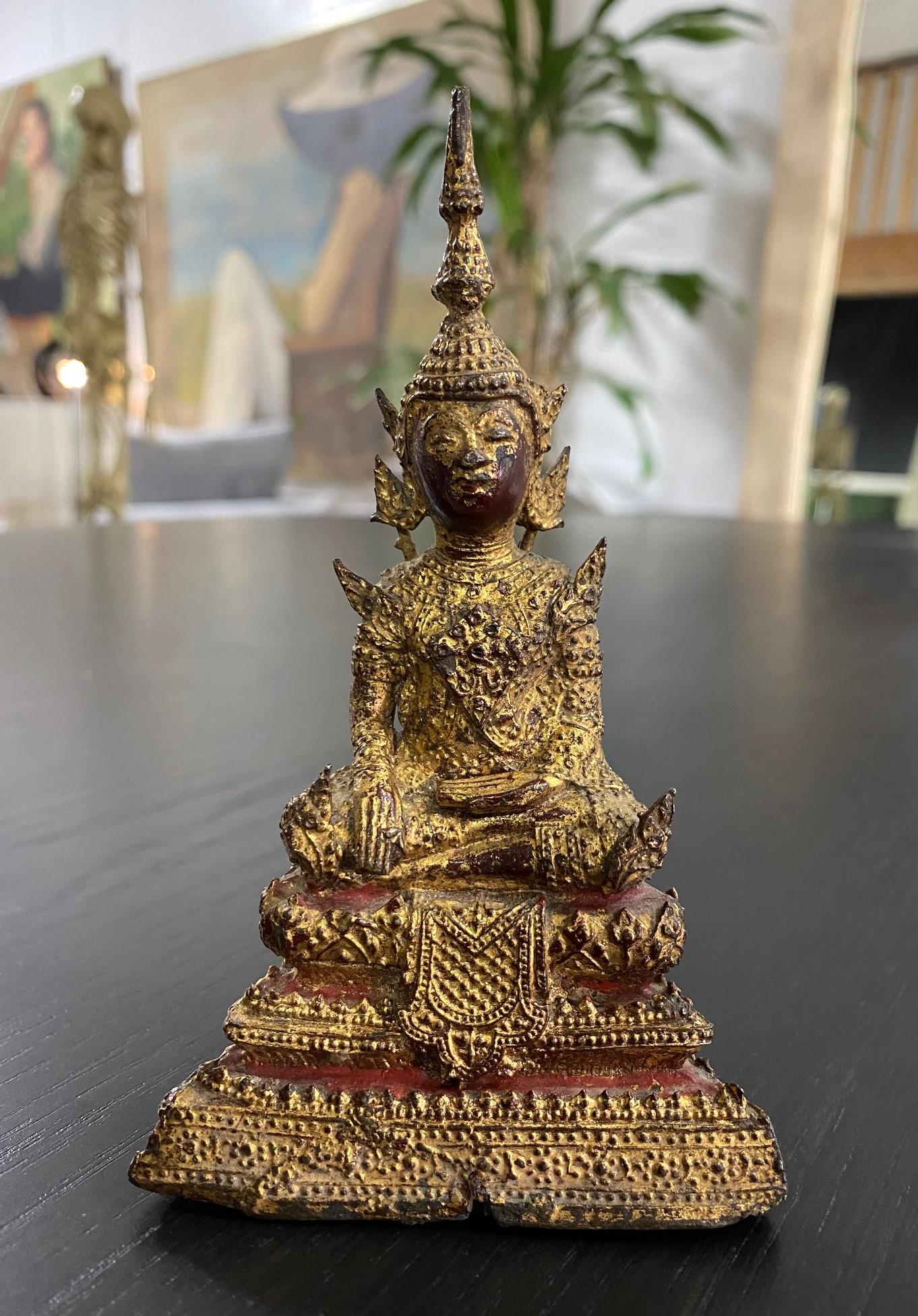 A wonderful gem of a piece. This beautifully sculpted and adorned bronze and gilt seated meditation Buddha is from the Thai Rattanakosin Kingdom period (1782-1932) and has a nice patina acquired through age. The Buddha is in the Bhumisparsha