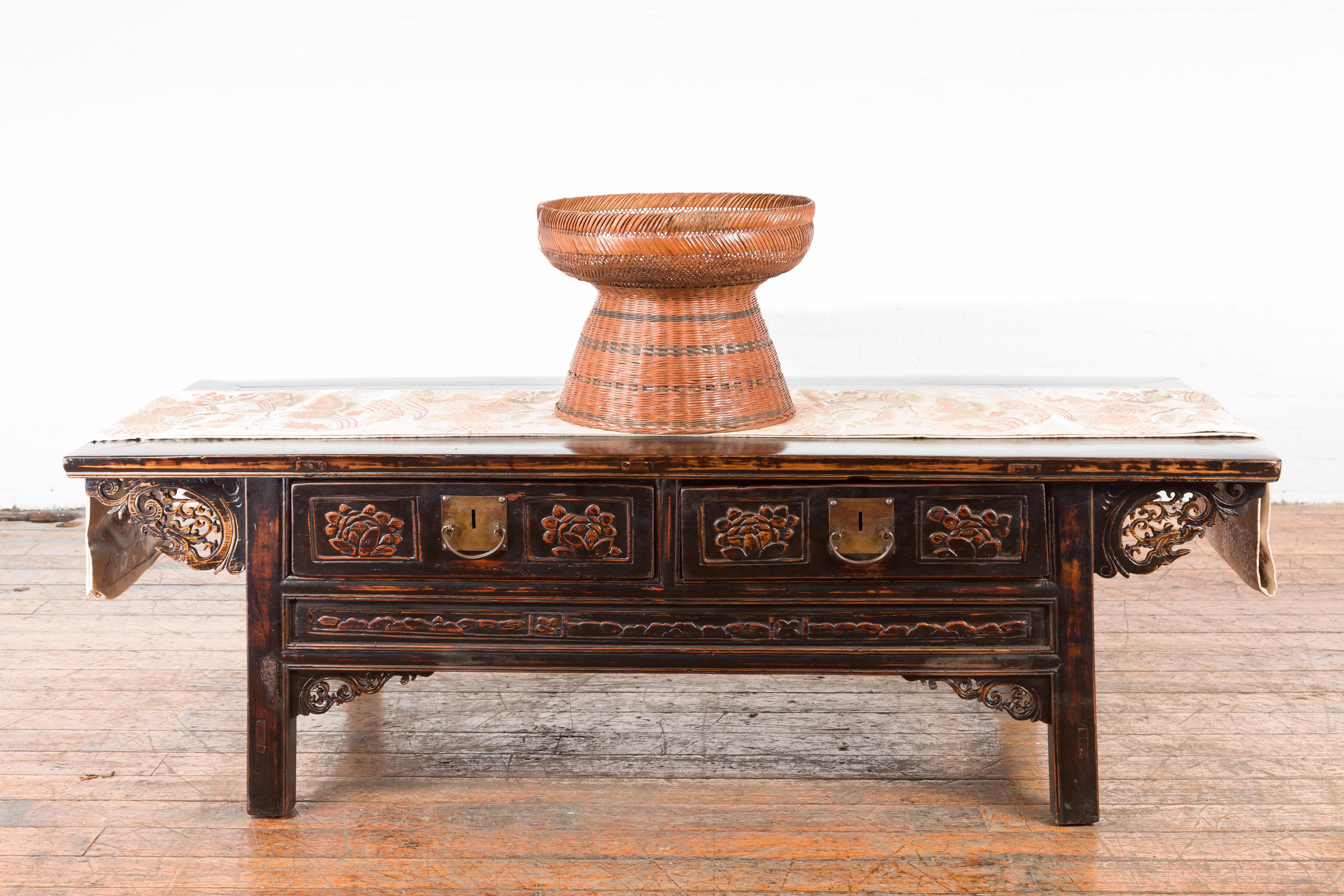 A Thai vintage woven rattan fruit market basket from the mid 20th century, with pedestal base. Created in Thailand during the midcentury period, this market basket features a deep circular top sitting above a nicely tapering pedestal base adorned