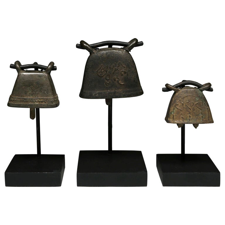 Thailand, Early 20th Century, Set of Three Brass Goat Bells on Stands