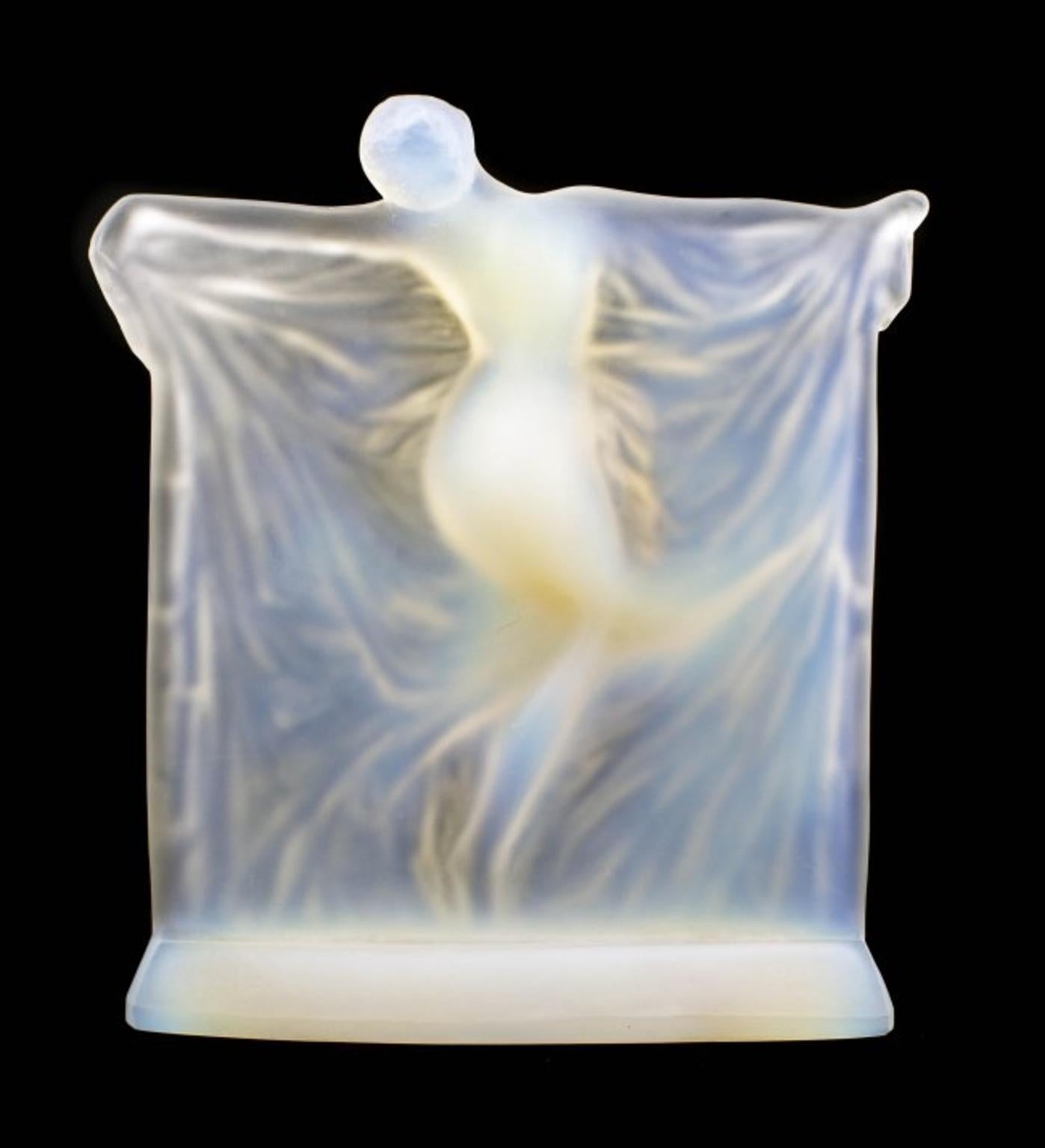 Thais opalescent glass statuette, René Lalique
An opalescent glass statuette, the nude female figure dancing and holding up a large diaphanous drapery
Marcilhac Reference 834.
Model introduced 1925
Measure: 8.4 in (21 cm) high
Inscribed R.