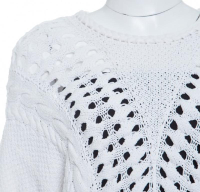 Made from a combination of cotton and nylon, this Thakoon top features an off-white body with chunky perforated knit and finished with rib trim. It offers a relaxed fit to the wearer and completed with short sleeves. Wear with a contrasting bralette