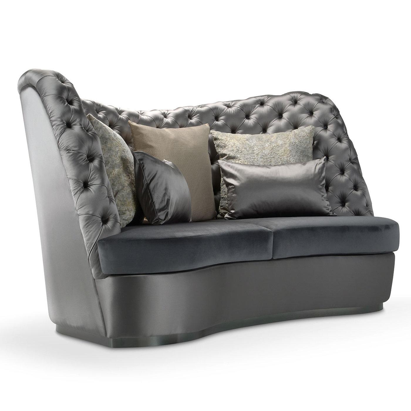 Part of the Thalia Collection named after one of the nine Muses and patron of comedy, this majestic, three-seater sofa exudes excellent sartorial quality. A sinuous plinth base in gunmetal-finished laminate sustains the imposing seat, which is