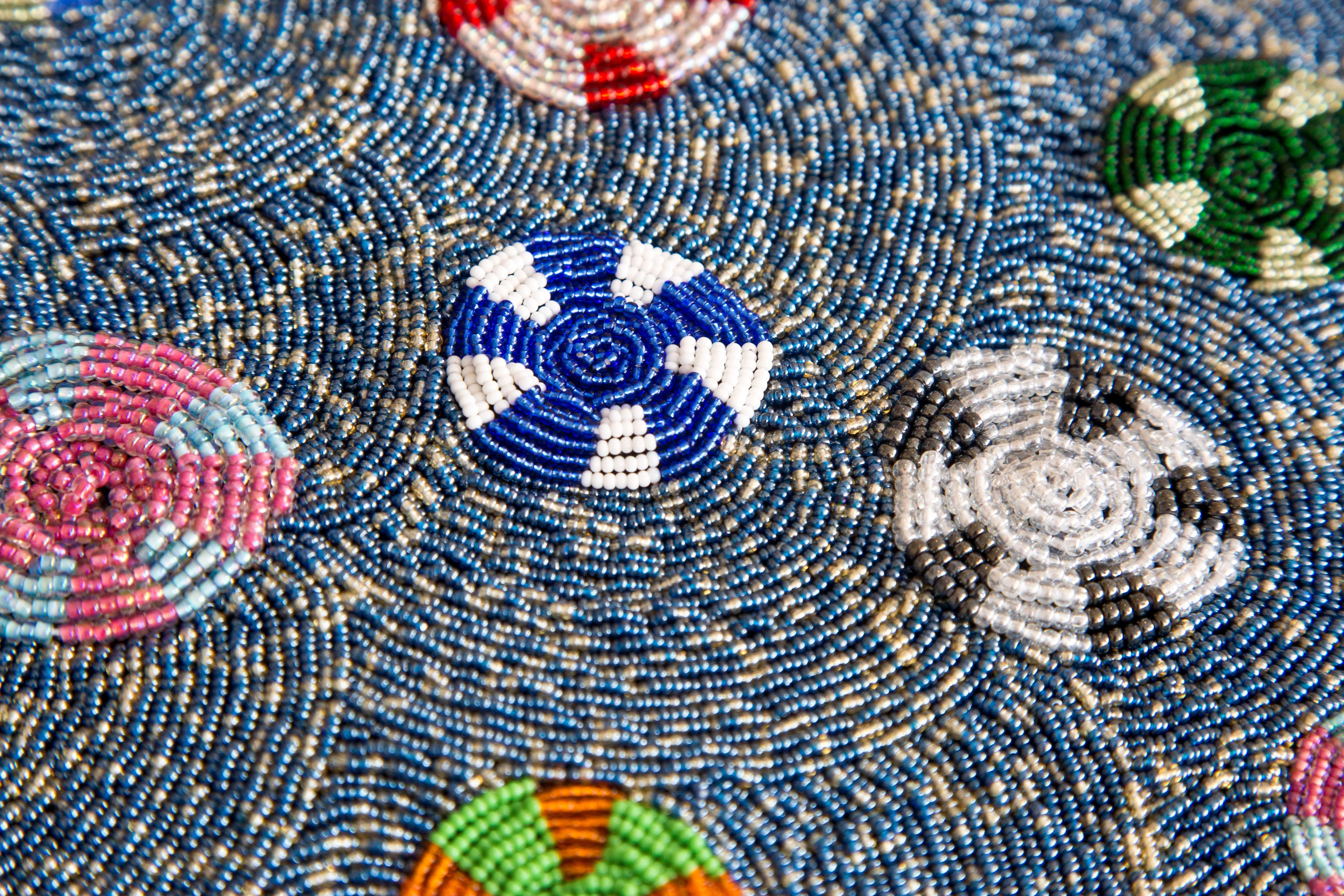 Ripples of thought by Thando Ntobela, glass beads sewn onto fabric, 2016. 

Ubuhle now centres on four artists – Ntombephi “Induna” Ntobela, Thando Ntobela, Zandile Ntobela and Zondlile Zondo – whose mastery of beading is on display: personal