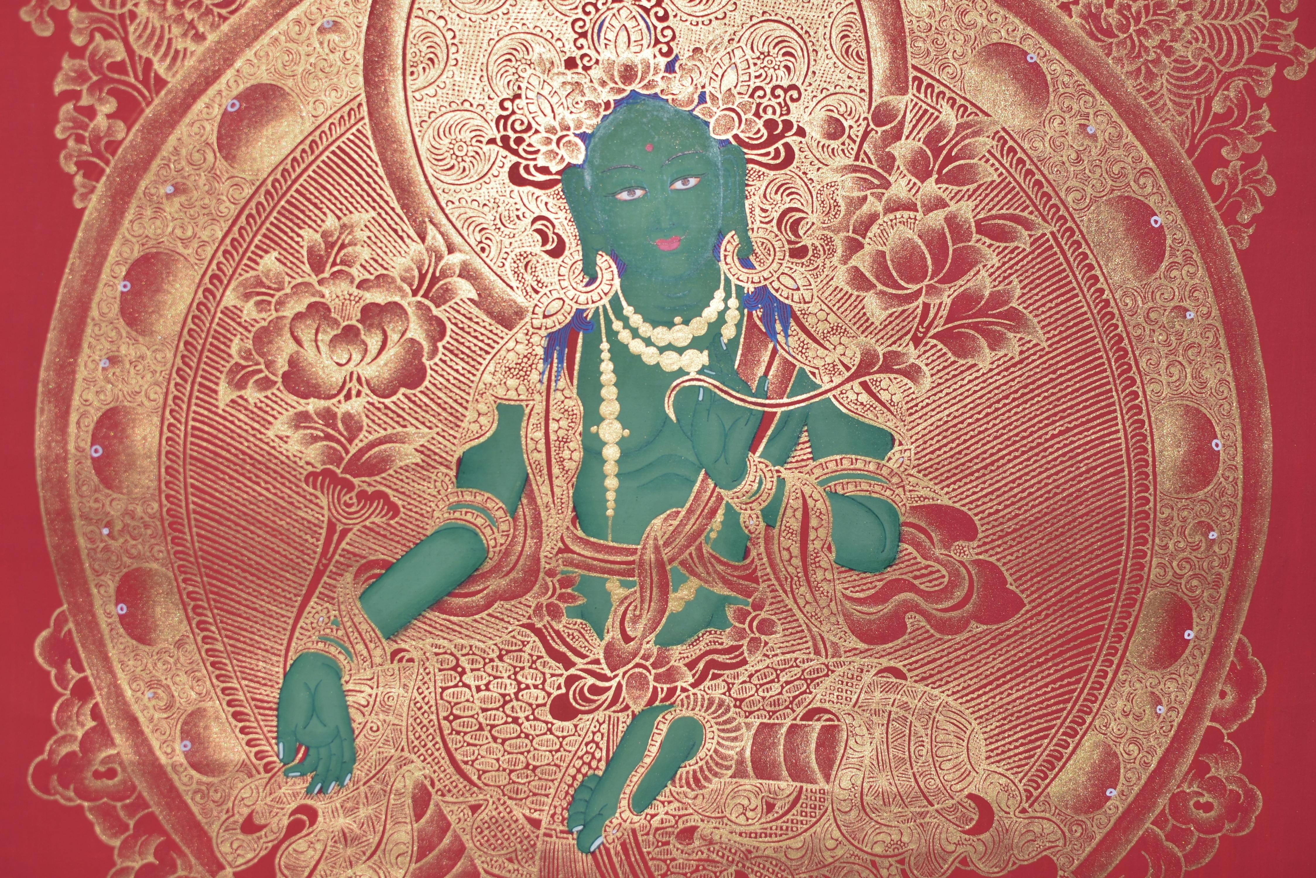 An exceptional, most unique, extra long hand painted Tibetan Thangka featuring the beloved Green Tara. Seated on a high lotus throne with a pair of holy beasts, her right leg extended, signifying her readiness to spring into action. The left leg is