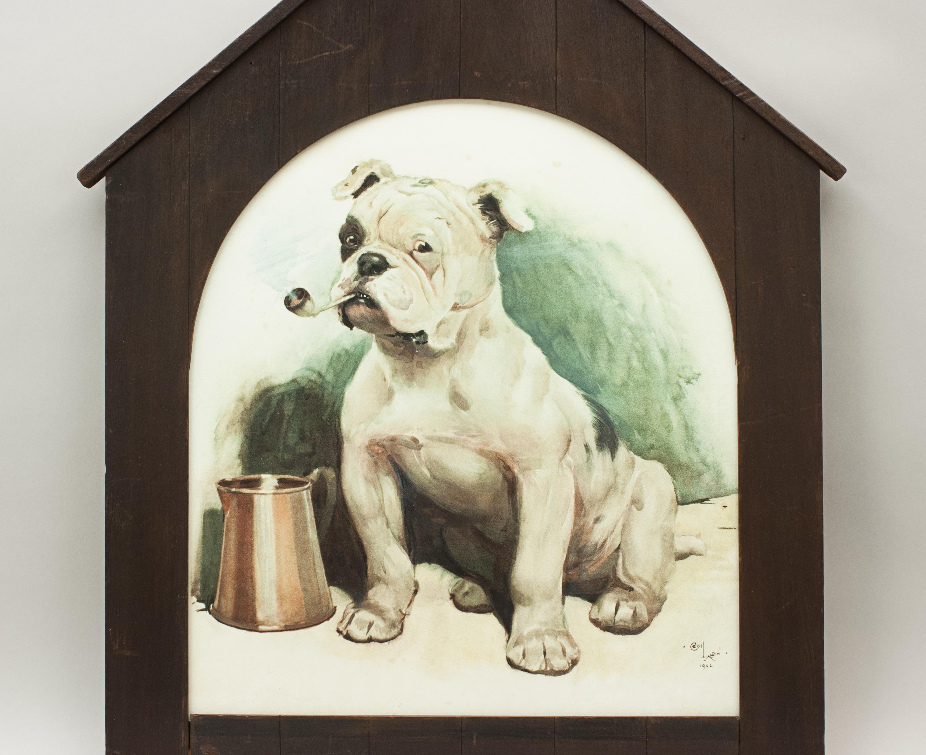 Cecil Aldin dog print, that's bully.
A classic piece of Aldin's canine work, 'That's Bully'. A color lithograph in original frame shaped like a dog kennel. 'Bully' Aldin's English bulldog can be seen standing in bold disobedience smoking a pipe