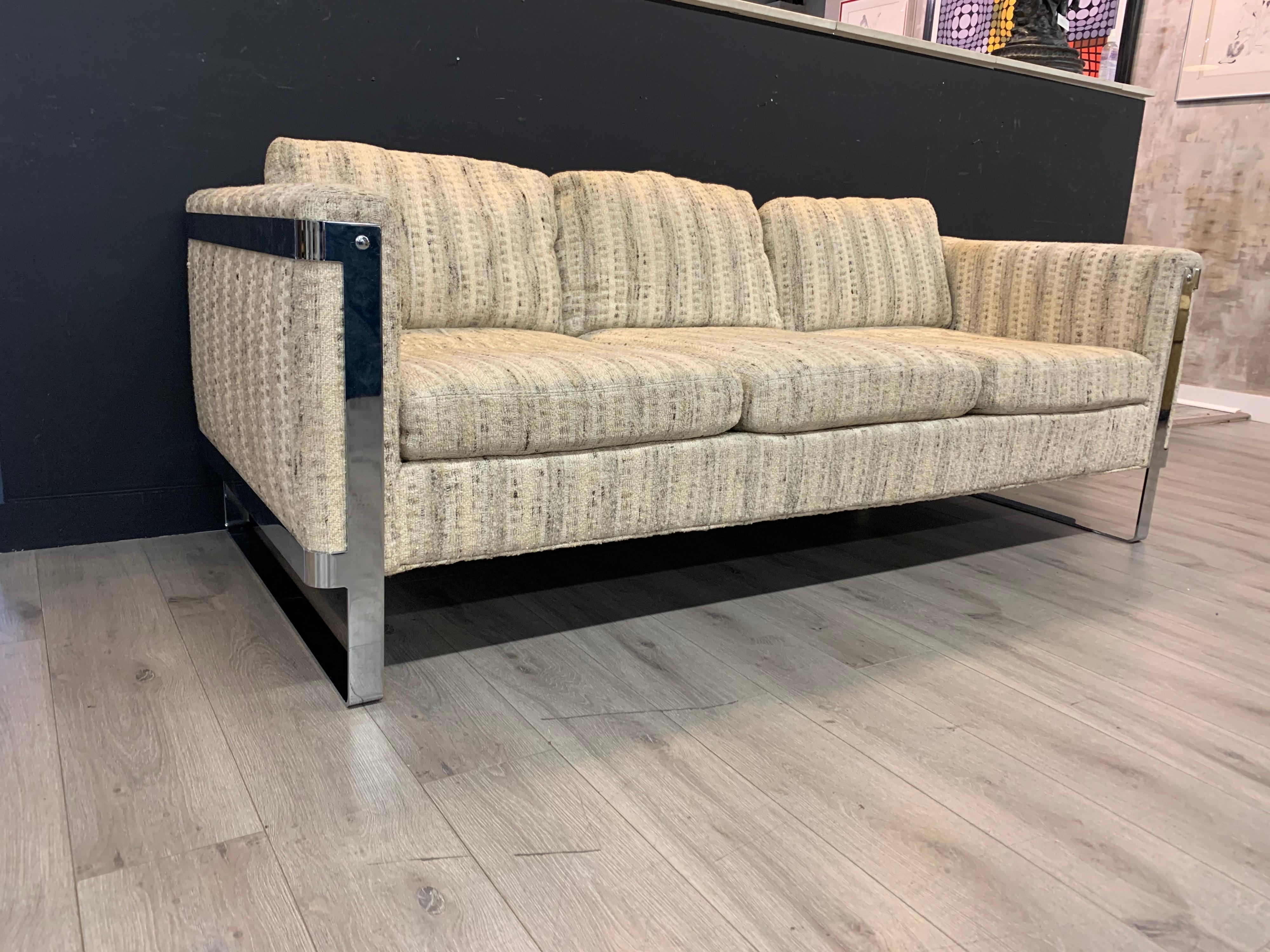 Rare smaller scale Thayer Coggin, attributed to Milo Baughman sofa that measures just over six feet wide and sits on floating steel base. The upholstery is original and still has plenty of life. Rara and iconic mid century sofas like this don't come