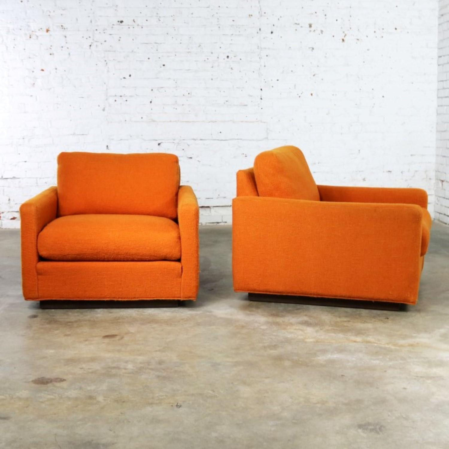 Handsome pair of cube Lawson style lounge chairs by Thayer Coggin attributed to Milo Baughman. They retain their original orange hopsack fabric. They are in wonderful vintage condition. We have shampooed them, and they can be used as is. However,