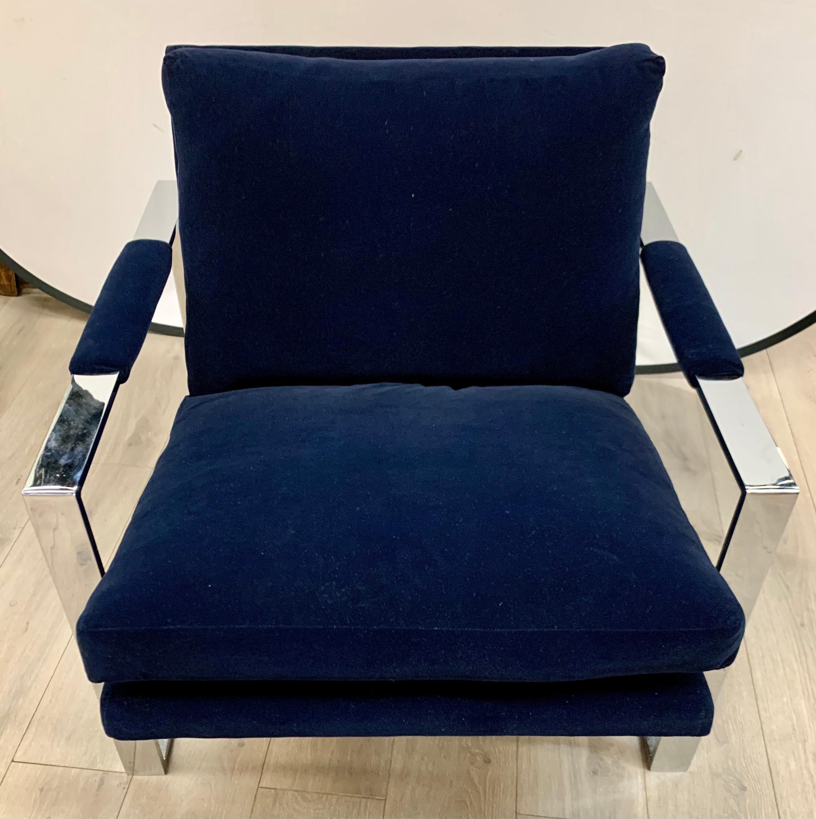 Newly upholstered in a luxurious solid navy blue velvet fabric and polished steel frame, this chair is sure to impress. The chair is heavy and has lines to die for. All dimensions are below. Now, more than ever, home is where the heart is.