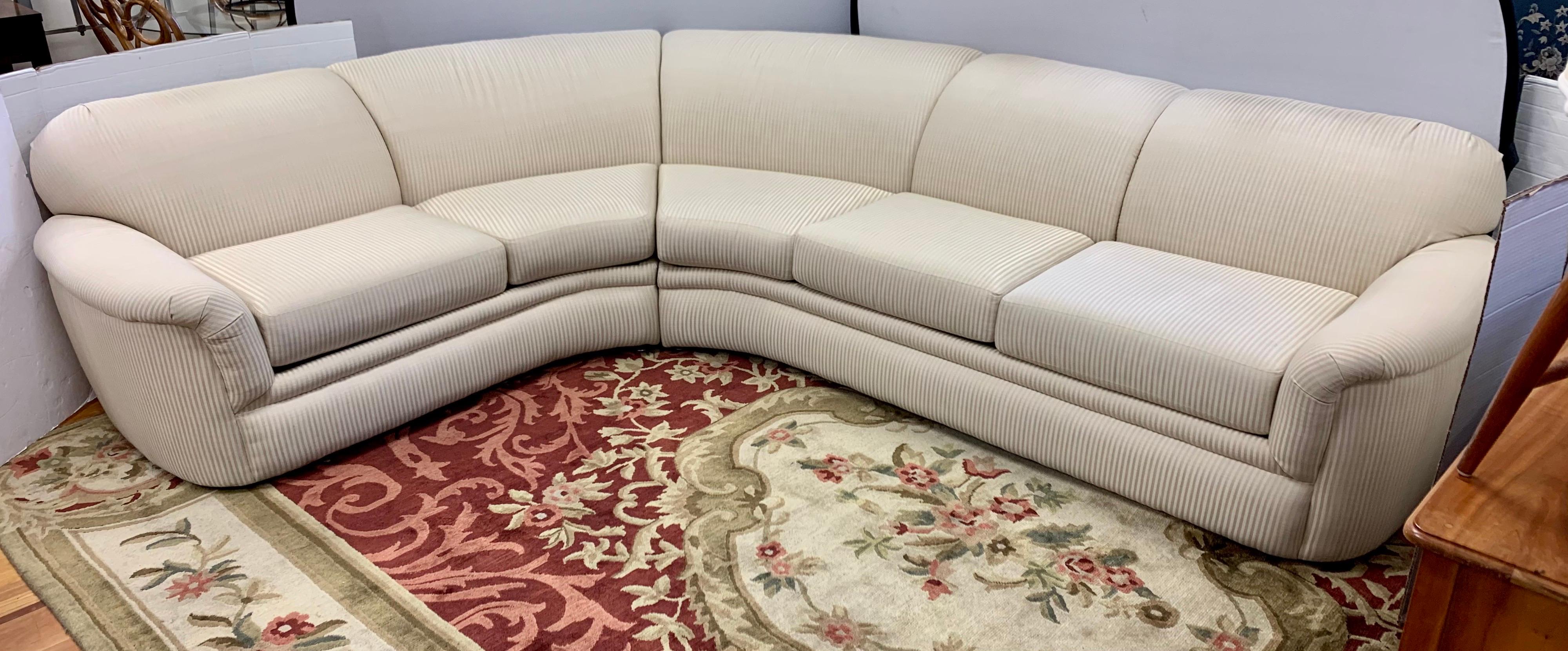 Elegant, two-piece Thayer Coggin sectional sofa. Magnificent subtle striped fabric. Neutral colors are tan and gold. Manufactured in High Point, North Carolina. Shape is almost semi-circular, see pics. Mint condition and features eight way hand tied