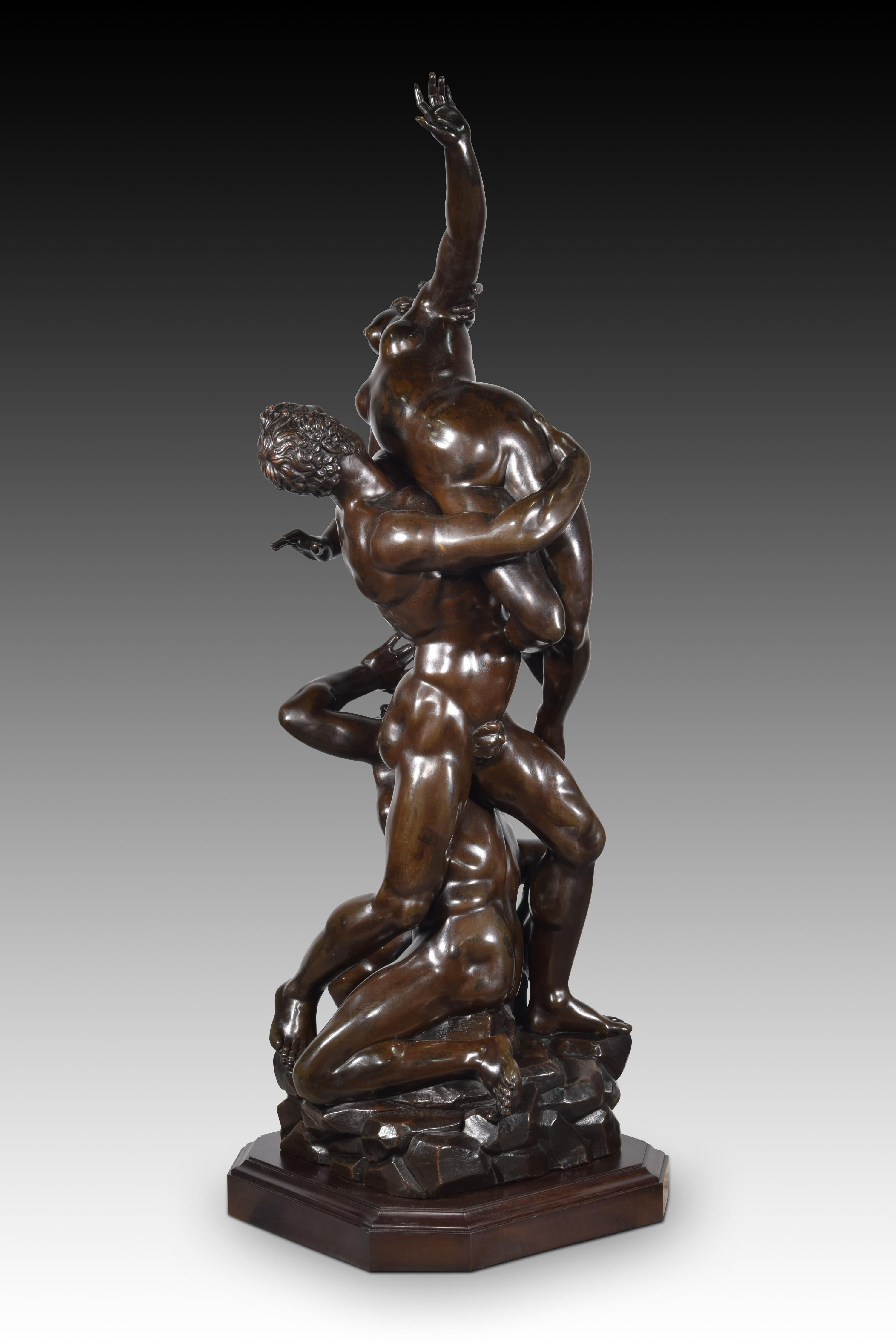 Kidnapping of the Sabine women. Bronze. XIX century, following the model of Giambologna (John of Bologna; Douai, 1529-Florence 1608). 
Patinated bronze sculpture made with the lost wax casting technique that has a small polygonal base, also dark.