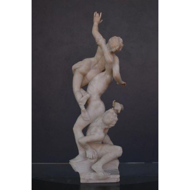 The abduction of the Sabines copy of the famous sculpture of Jean de Bologna from the 19th century, the sculpture is in alabaster and the base in green marble, height 97 cm (base included). Height of the statue 70 cm by a width of about 22 cm. Note