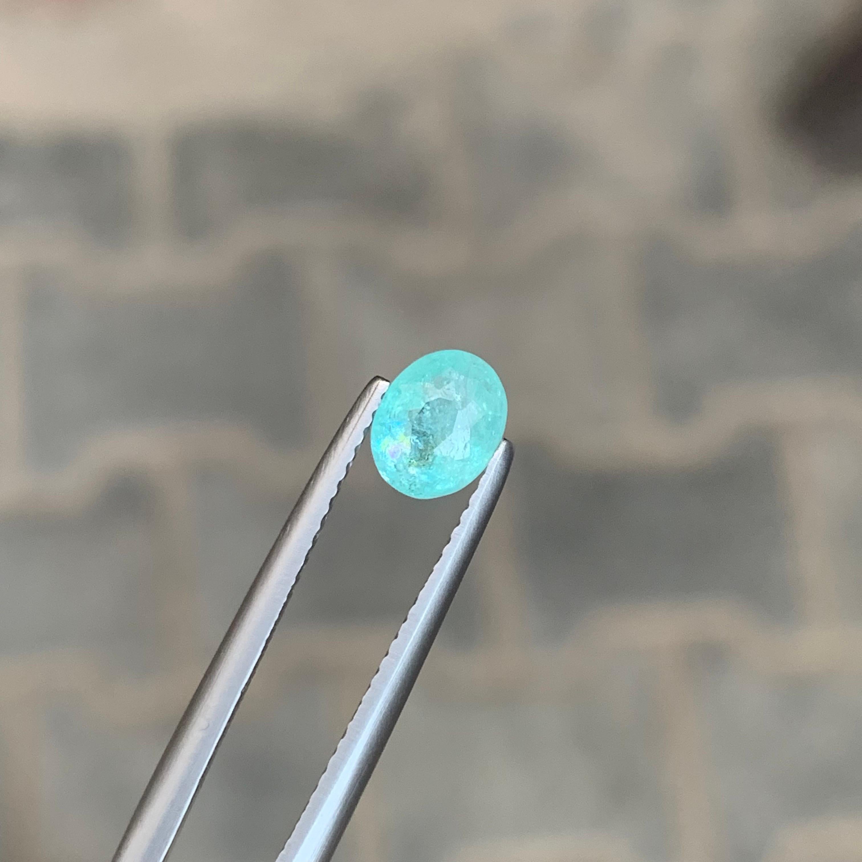 Gemma di forma ovale di tormalina Paraiba sciolta naturale certificata AIG da 0,98 carati in vendita 3