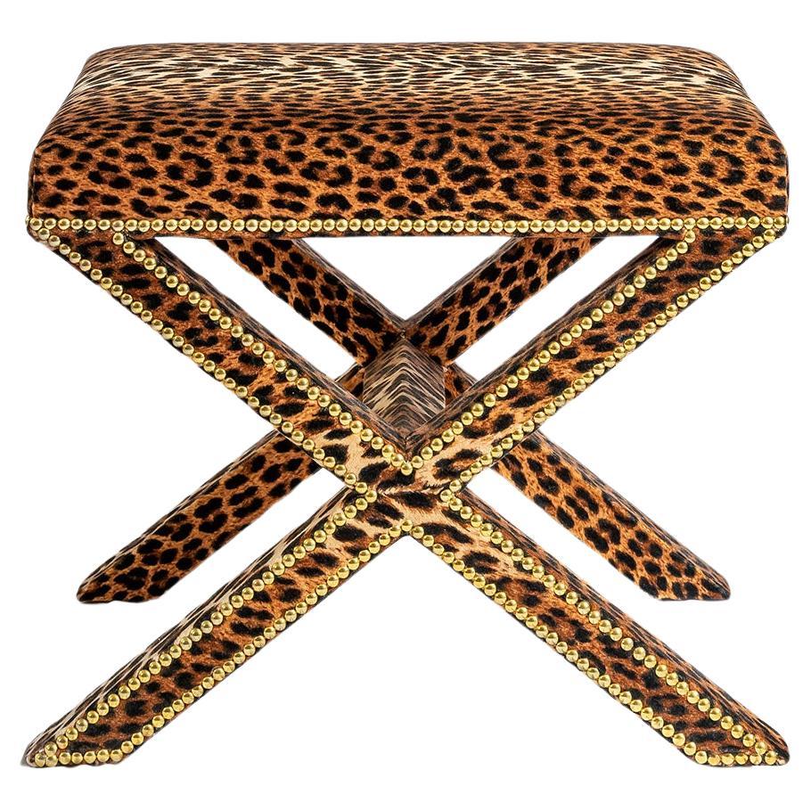 The Alexander X-Frame stool, upholstered in Leopard Velvet with nailing detail For Sale