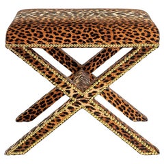 The Alexander X-Frame stool, upholstered in Leopard Velvet with nailing detail