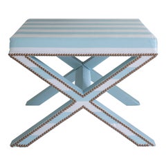 The Alexander X-Frame stool, upholstered in striped silk with nailing detail