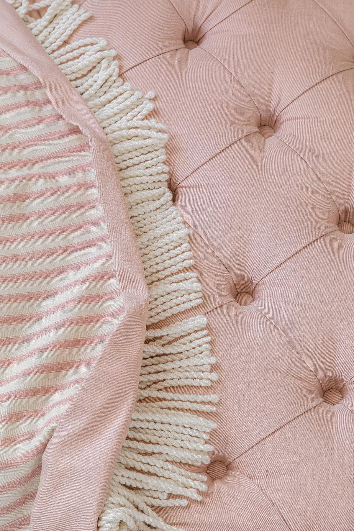 Hand-Crafted The Amelia Ottoman in deep buttoned pink linen, ticking stripe & bullion fringe For Sale