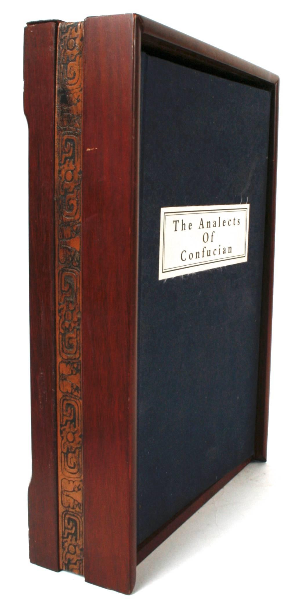 The Analects of Confucian. No publisher or date. This is a deluxe collectible silk edition of the Analects of Confucius in three volumes including an English translation. It is printed on silk sheets, lined in silk and covered in a traditional lotus