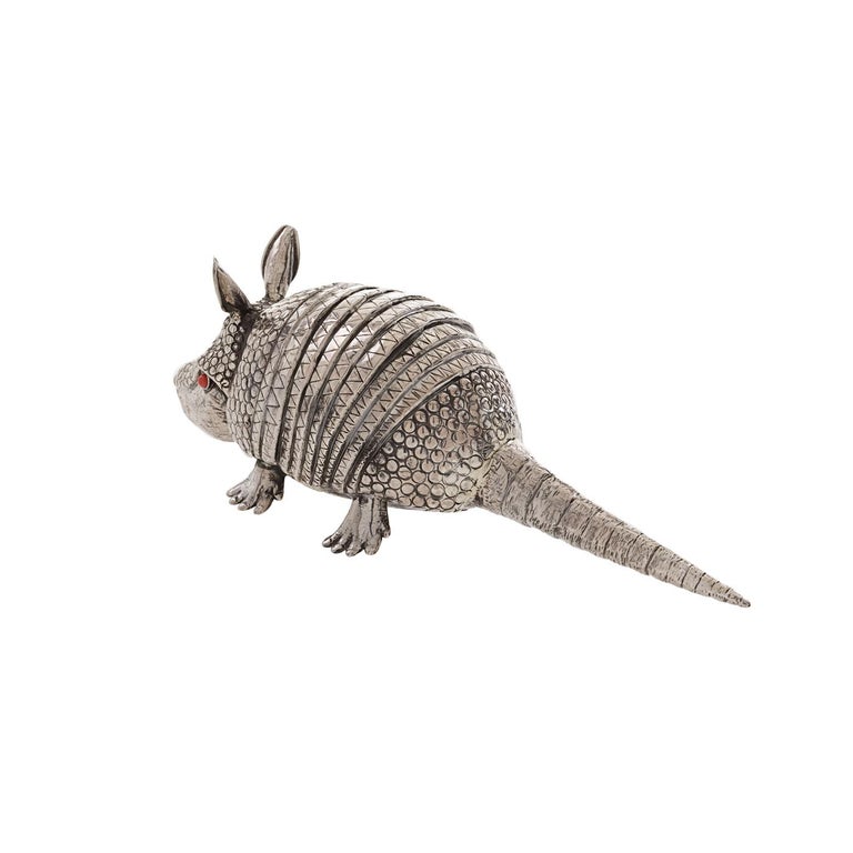 Playful true-to-life silver armadillo that serves as a lighter other than being a decorative artwork in its own right. Expertly made by the Florentine silversmiths, the Lisi brothers, its realism and expressive quality are quite uncanny.