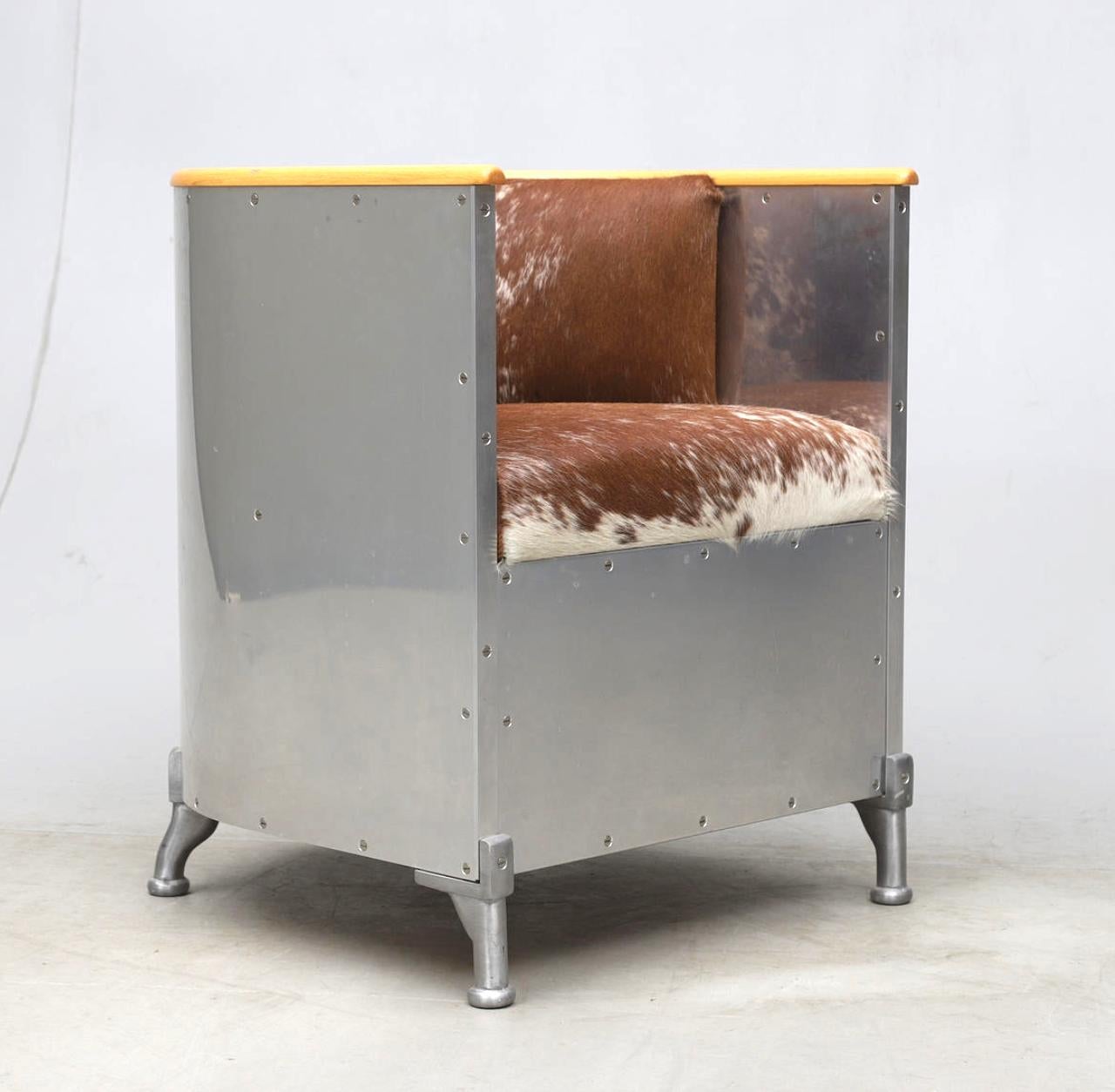The armchair designed by MATS THESELIUS. Model  “Aluminium chair”, produced by Källemo, numbered 2/33.

Frame in aluminum. Cast aluminum legs. Frame in book. Firmly upholstered back and seat, covered with cowhide. Seat height approx. 18″. Total