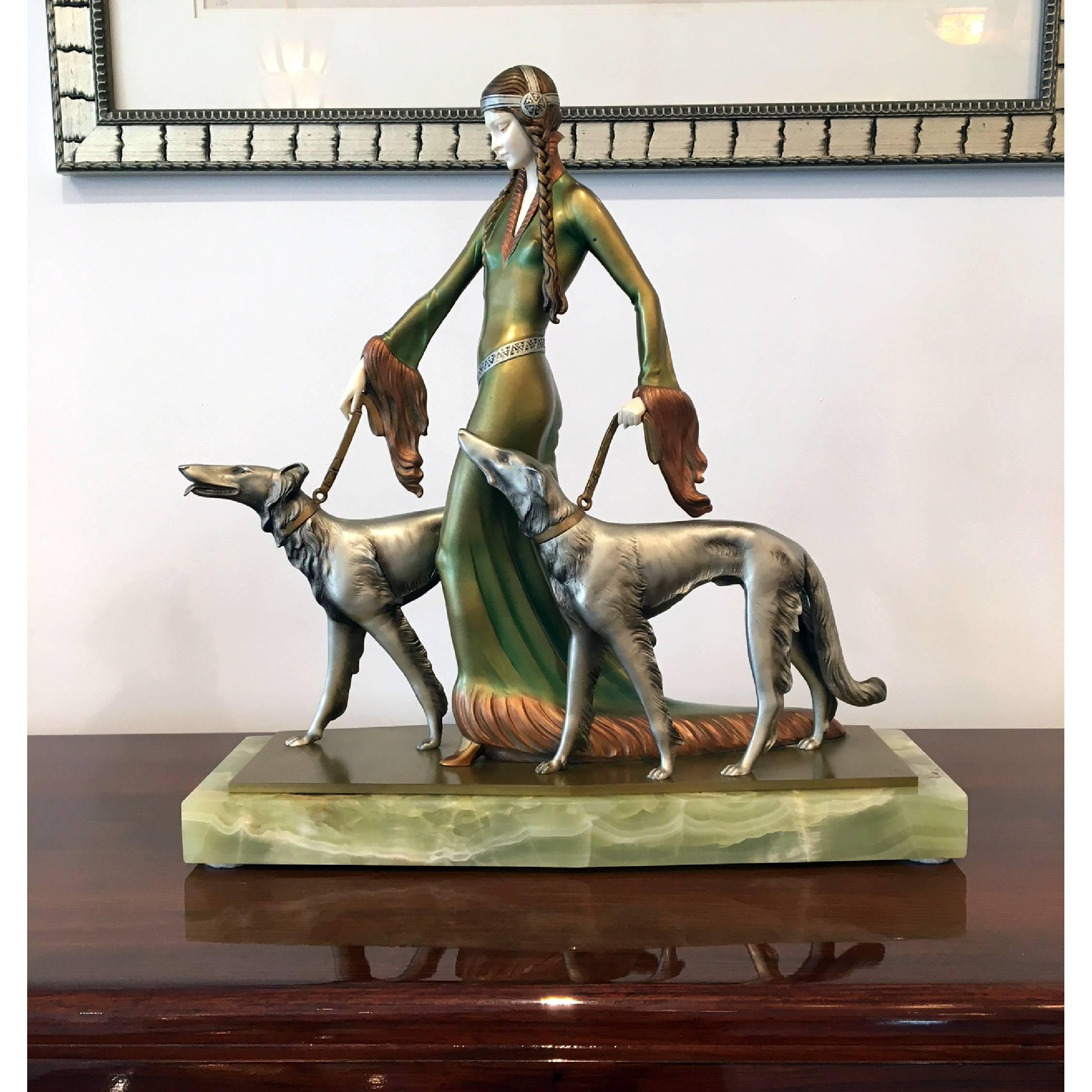 A beautiful Art Deco sculpture by Prof. Otto Poertzel entitled The Aristocrats, this gorgeous piece depicts a female stylized figure with two hounds it sits on a onyx base with a cold painted lime-green patina.
Made in Germany 
circa 1935
Same