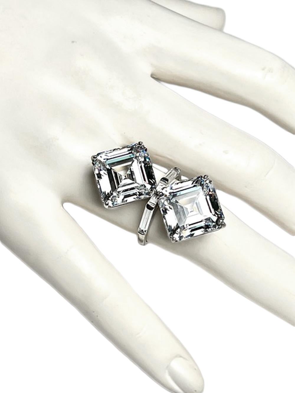 The Art Deco Toi et Moi Love Ring Lab Grown D Grade Diamond Cut Cubic Zirconia  10 Carat Each Asscher Cut Diamonds

Two stunning man-made diamonds, cut in the Asscher cut style and set with baguettes, Art Deco style  Brilliant D-colour equivalent