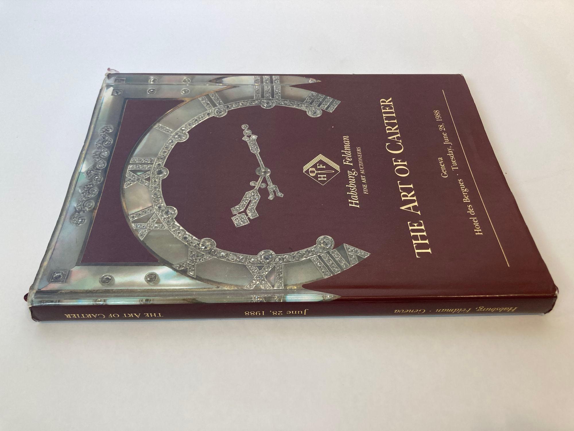 The Art of Cartier 1988 Geneva auction hardcover book catalog.
The Art of Cartier Habsburg Feldman auction hardcover.
135-page catalog June 28, 1988, 216 fabulous lots.
Hardcover with dustcover.
Dimensions: 11 in x 8 in.
Cartier was founded in