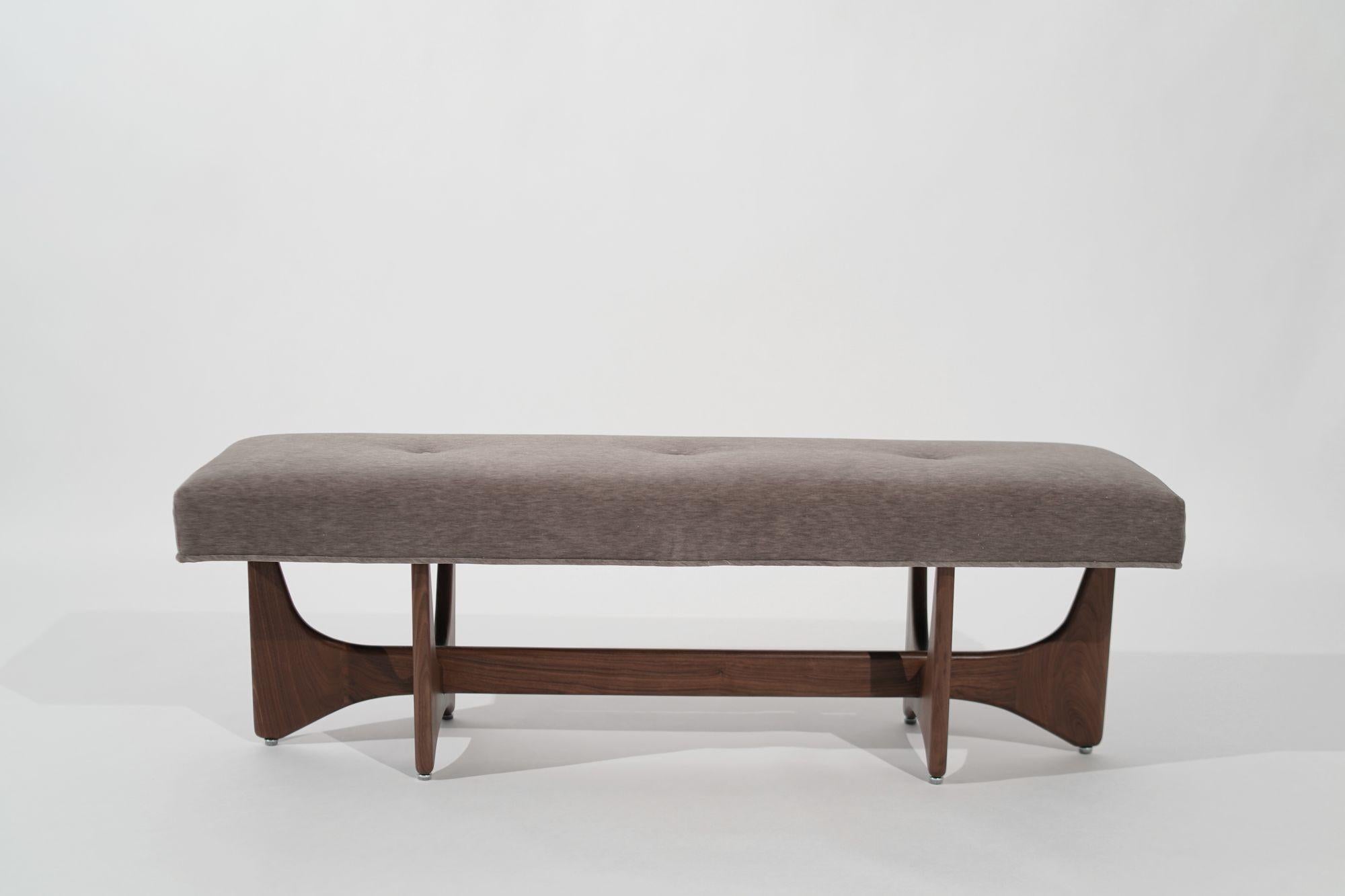 Introducing the Artisanal Bench by Stamford Modern, a captivating sculptural masterpiece that seamlessly blends artistry and functionality. Handcrafted from exquisite solid walnut, this bench elevates any space with its organic shapes and