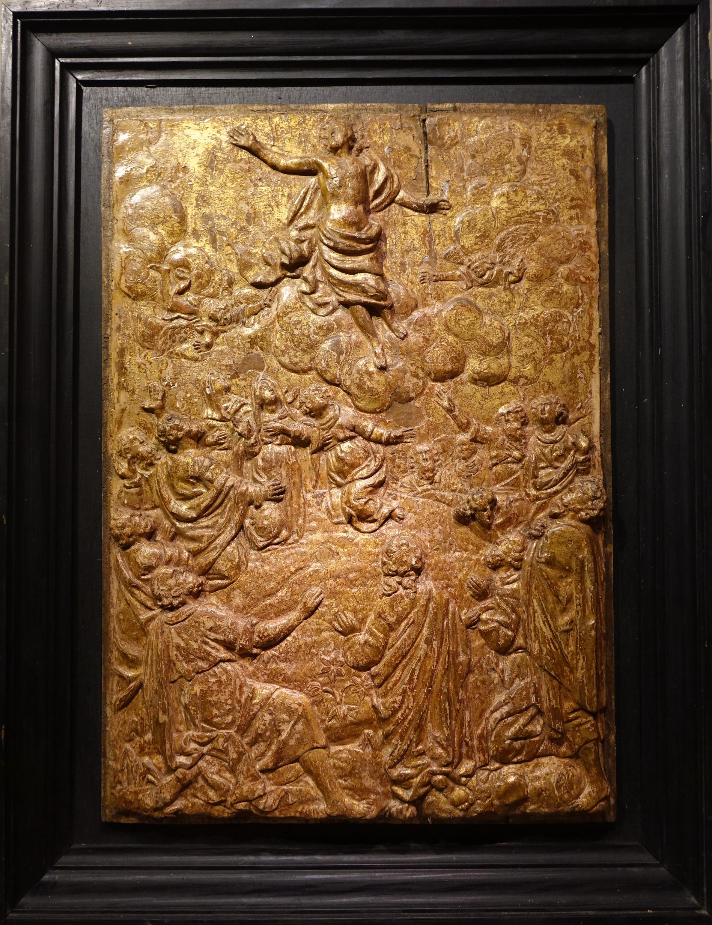 Bas-relief in sculpted and gilded wood portraying the Ascension of Christ. 
By ascending to heaven, Jesus fulfils the meaning of his resurrection: to join, with his body, in the glory of God. 
The celebration of the Ascension takes place 40 days
