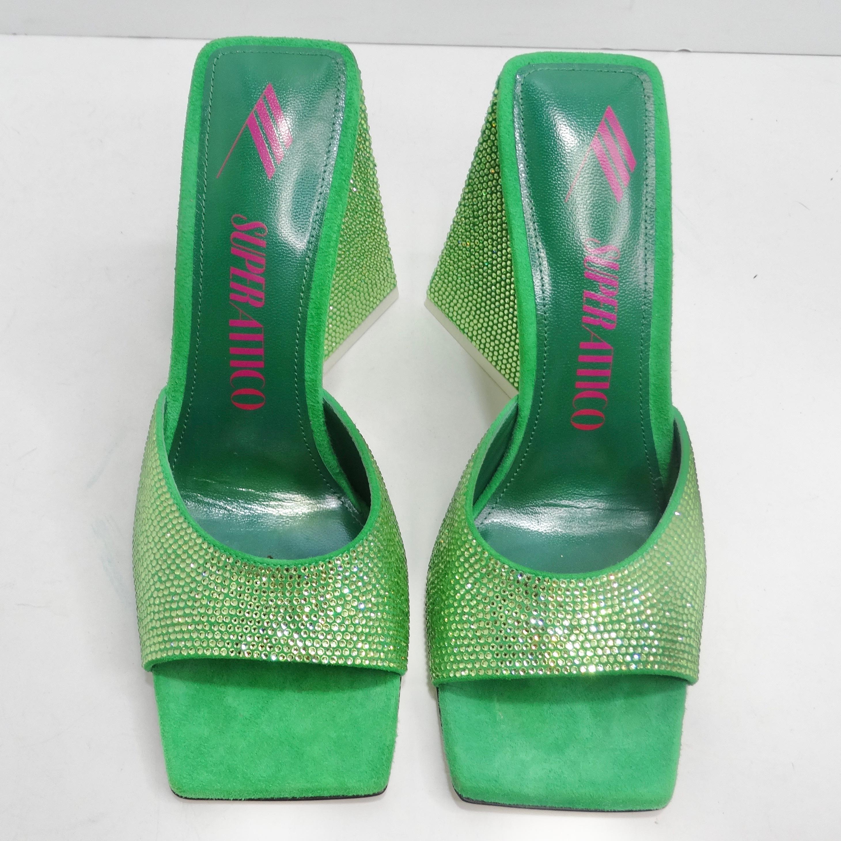 Step into sophistication with The Attico Green Devon Heeled Sandals—an exquisite pair of shoes that redefine glamour with every step. These green suede heeled mules are not just shoes; they're a dazzling display of craftsmanship and style. Picture