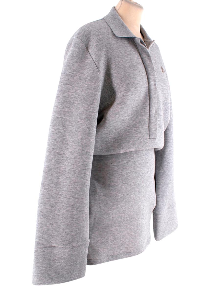 The Attico Grey Marl Jersey Polo Mini Dress
 

 - Grey marl cotton blend
 - Polo-shirt style collar
 - Gathered waist for blouson effect
 - Close fitting through the skirt
 - Wide sleeves
 - Inset side pockets
 

 Materials 
 Cotton 
 Nylon 
 

