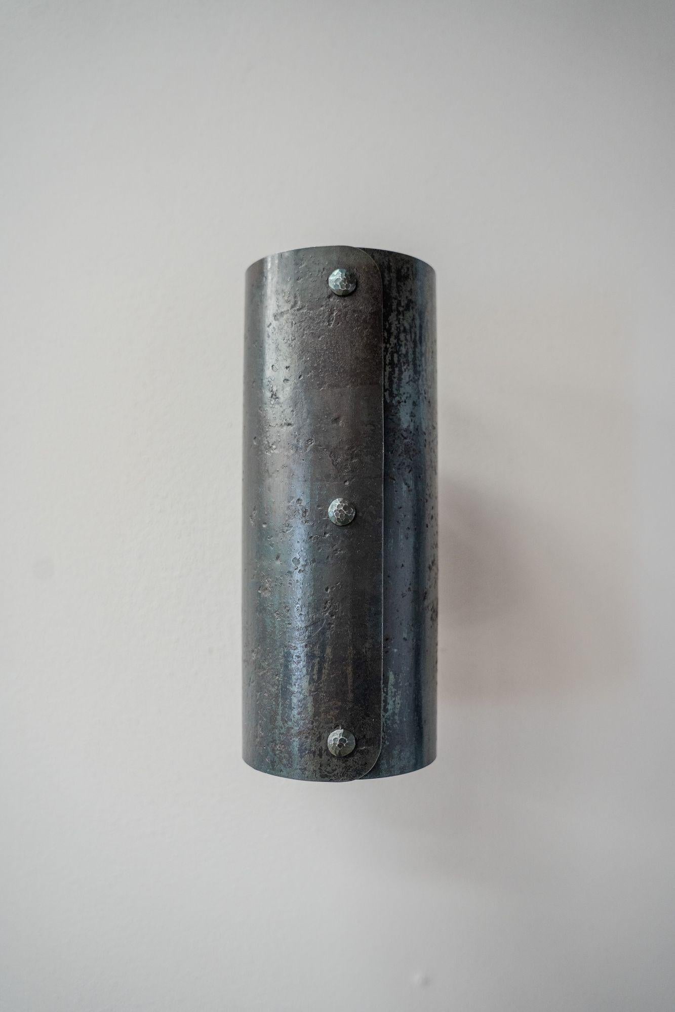 This is our 'Baldr' Wall light. The Norse god of light and wisdom. Made from forged steel right here in Yorkshire by Sam our incredible blacksmith.

The whole process to roll and craft this wall light a patina is gained that creates such a stunning
