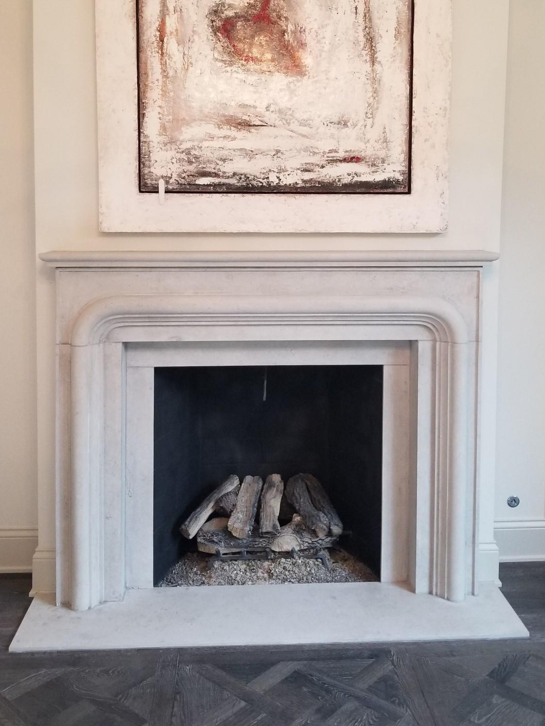 American The Balzac:  A Transitional Stone Fireplace with a Bold Curving Frame For Sale
