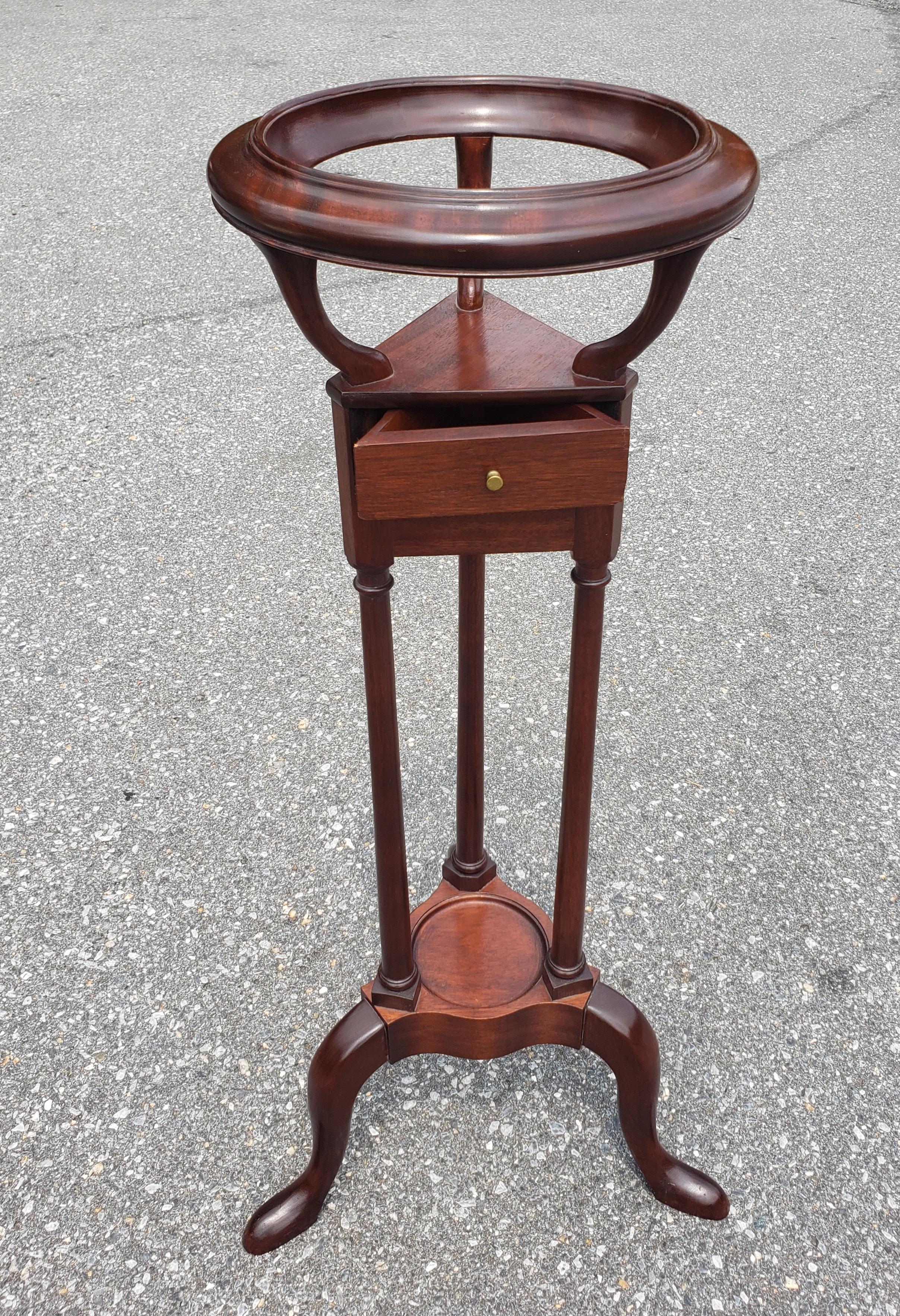 Handcrafted by George From The Barley Collection Ltd, is this George III style mahogany wash or wig stand, with the moulded top of circular form raised over three curved supports above moulded shelf of triangular form with one two drawer and