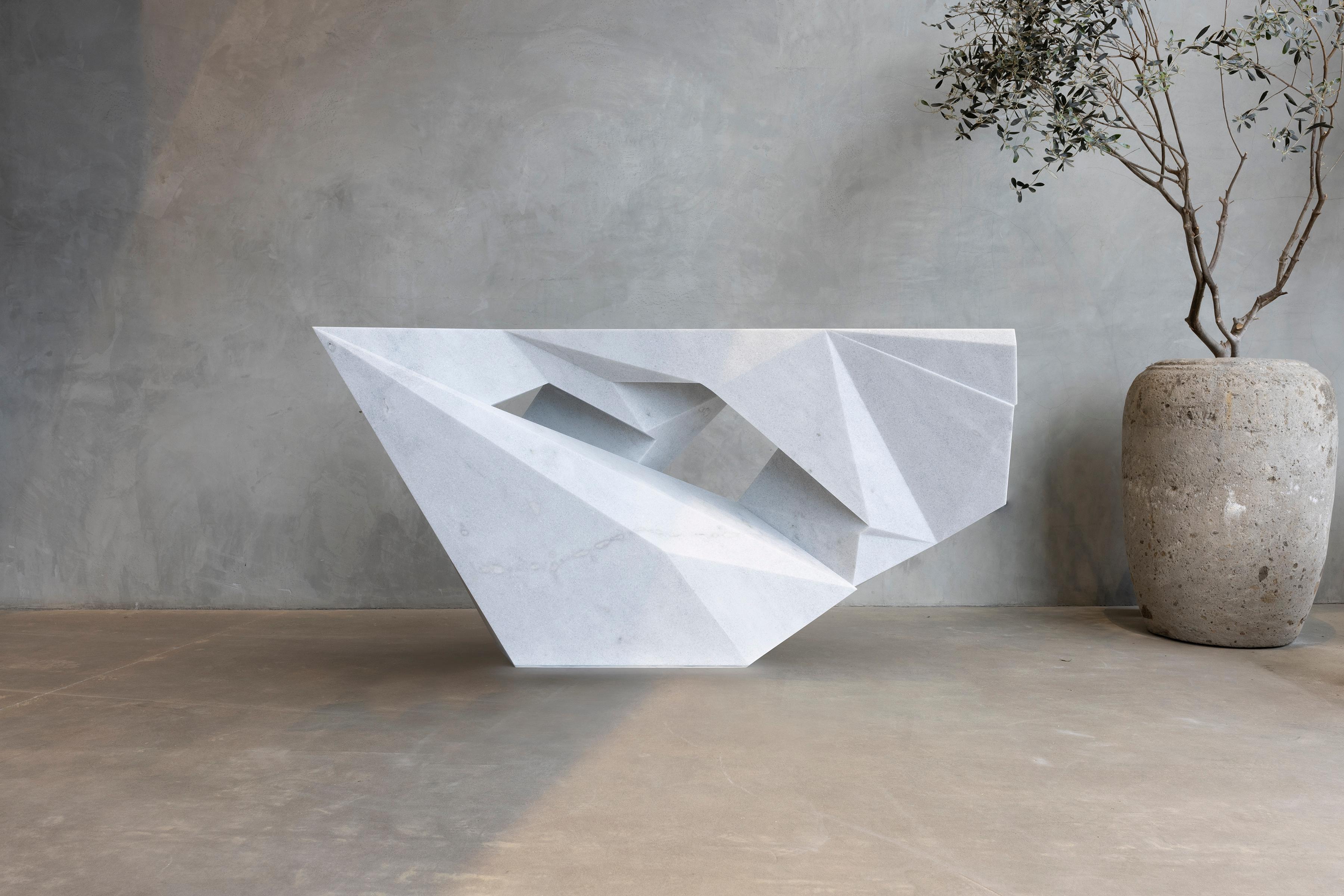 The Berg Chair by William Emmerson
Limited Edition Of 2 Pieces.
Dimensions: D 36,5 x W 66,5 x H 39 cm.
Materials: Naxos marble.
 
A shape. A floating mass of white marble turned into a piece of functional sculpture representing the beauty behind