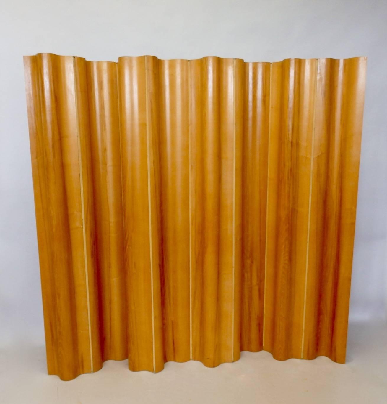 Developed as a result of Charles Eames experiments for molded plywood. Resulting in his leg splint for the U.S. Government and later advancement in mass produced furniture design. This FSW - 8 that is folding screen wood eight panels I believe to be