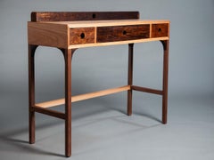 The Bi Writing Desk. Handcrafted from solid jequitibá and imbuia wood.